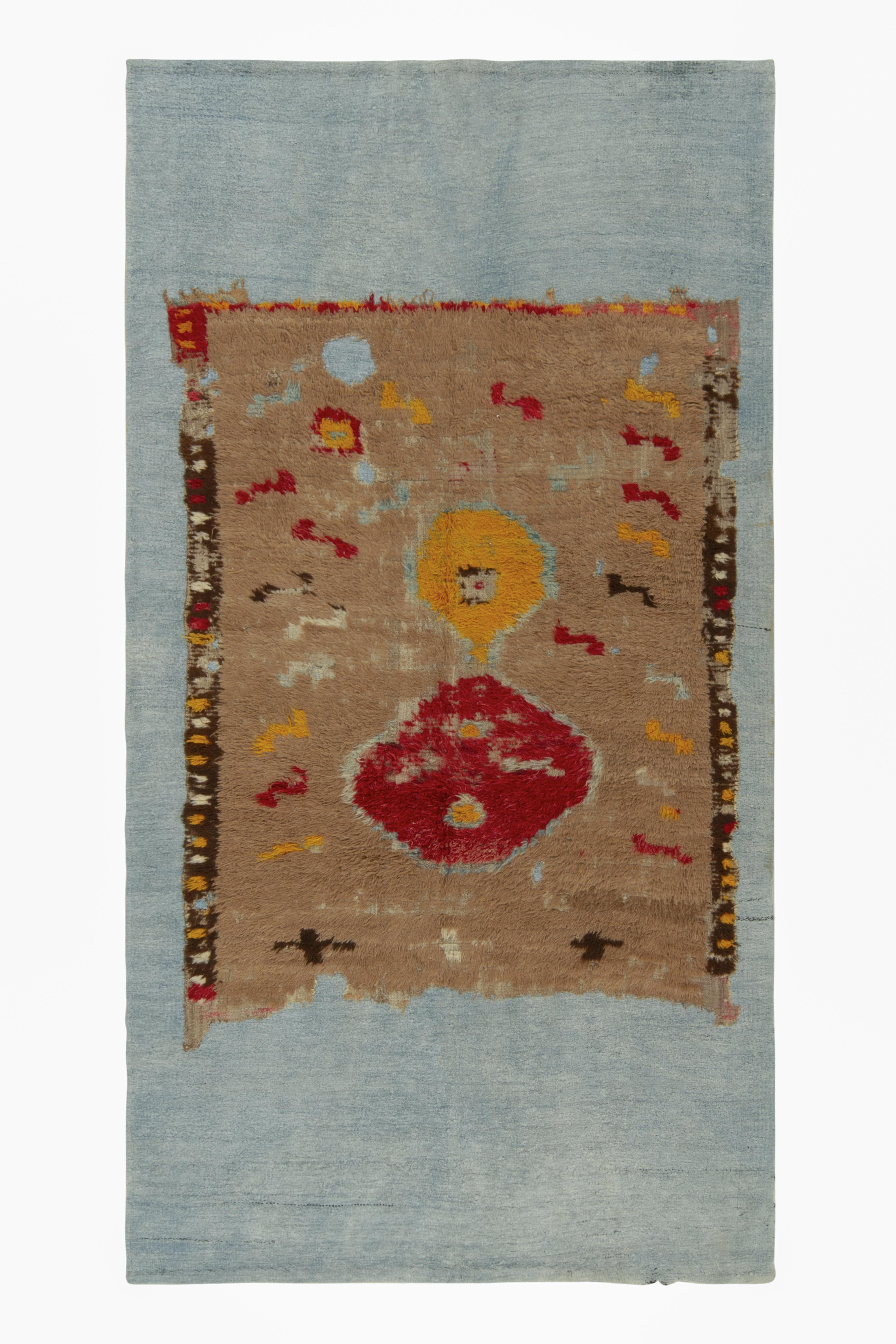 Rug & Kilim's Distressed Brown rug fragment on blue flat weave For Sale