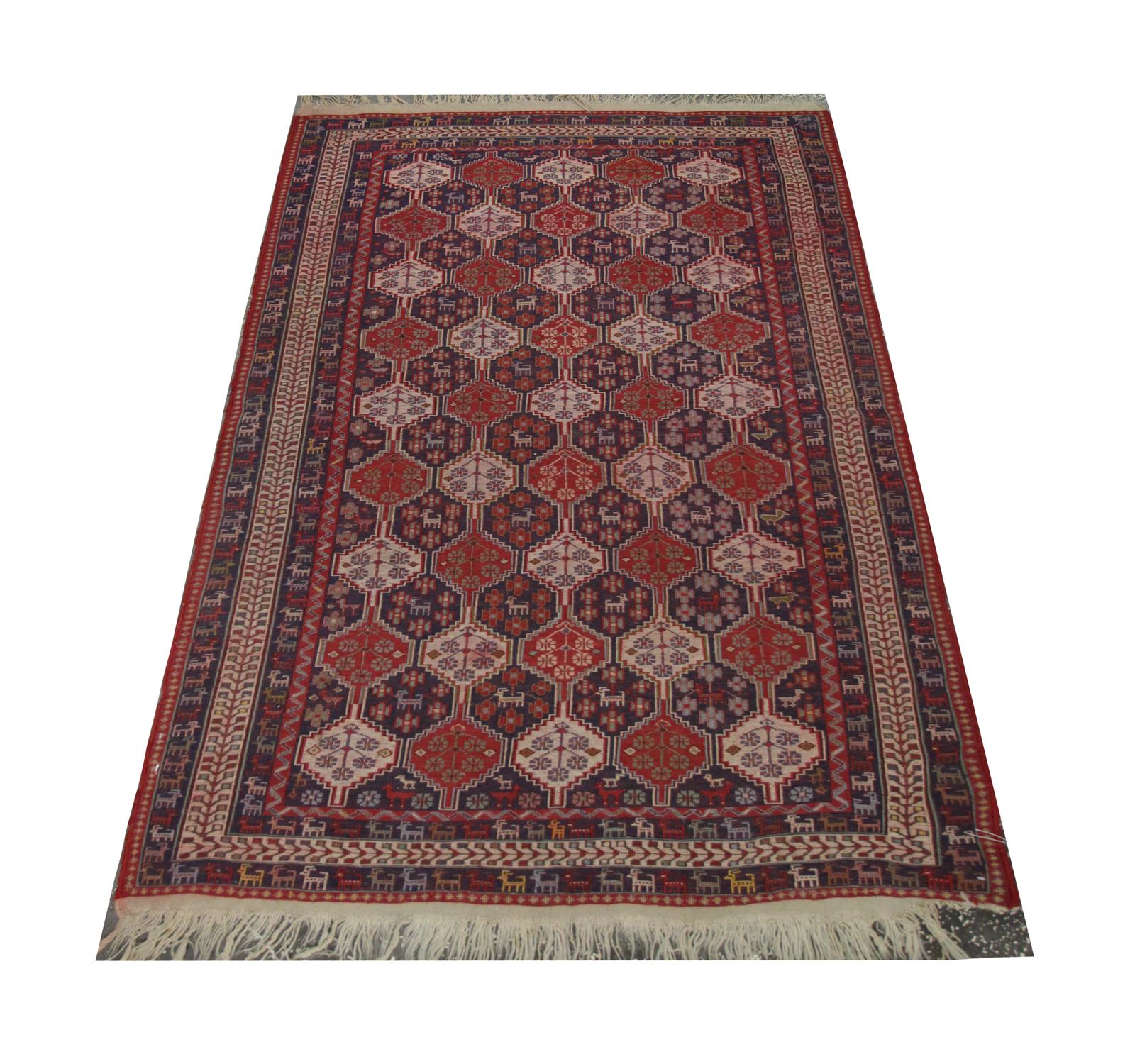 This fine wool rug is an excellent example of oriental Geometric Floral motifs that decorate the central design of this Sumakh kilim, delicately woven in a repeating pattern with bold colours including red, blue, ivory and green. This is then framed