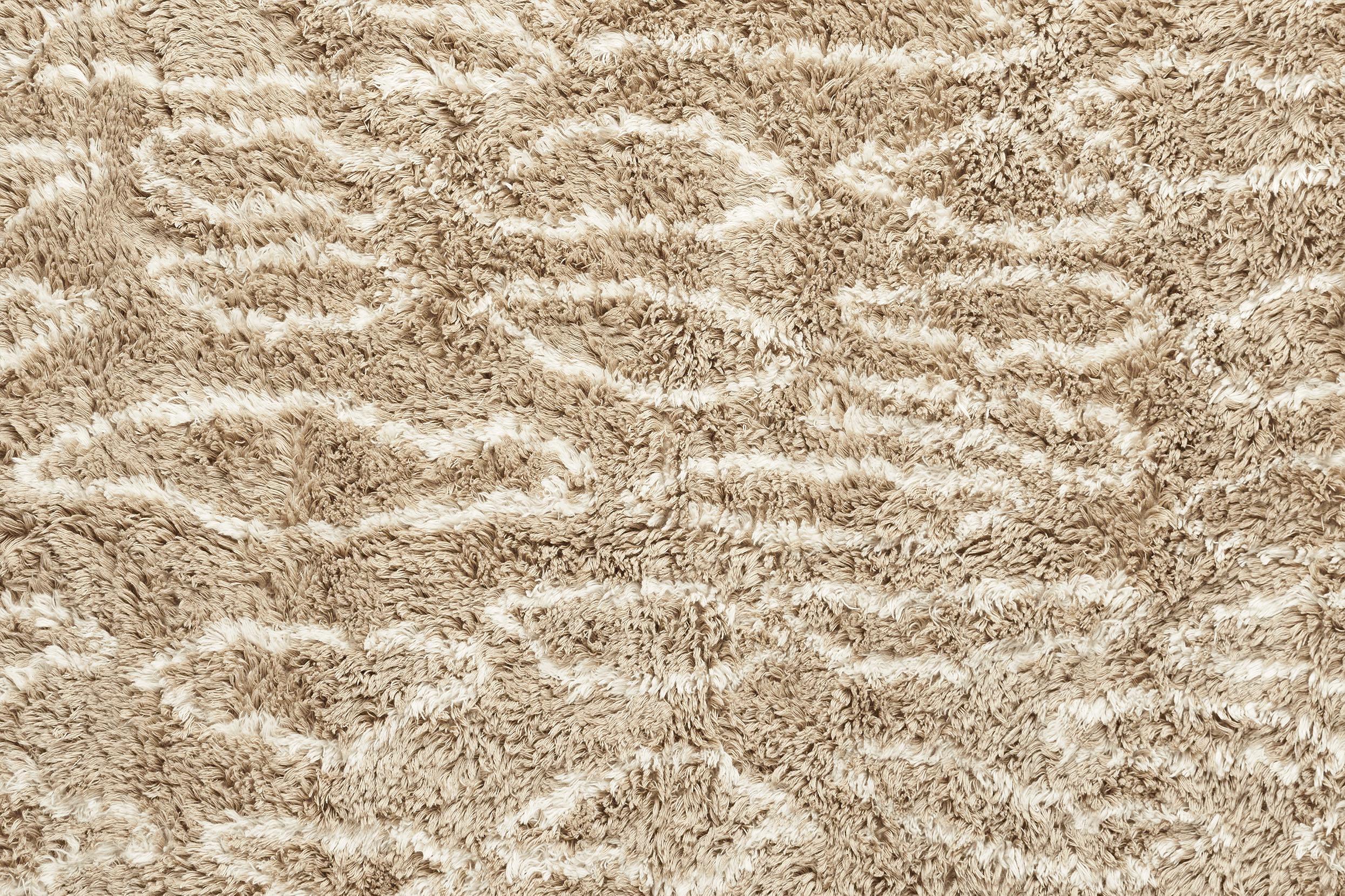 Hand tufted 100 % wool pile with cotton backing, each rug has a unique and irregular leo pattern and with that gets a really cool 70s vibe.

Available in beige and grey.

Material: Hand woven 100 % wool. 

Size: 200 x 300 cm / 6 x 9 feet.
 