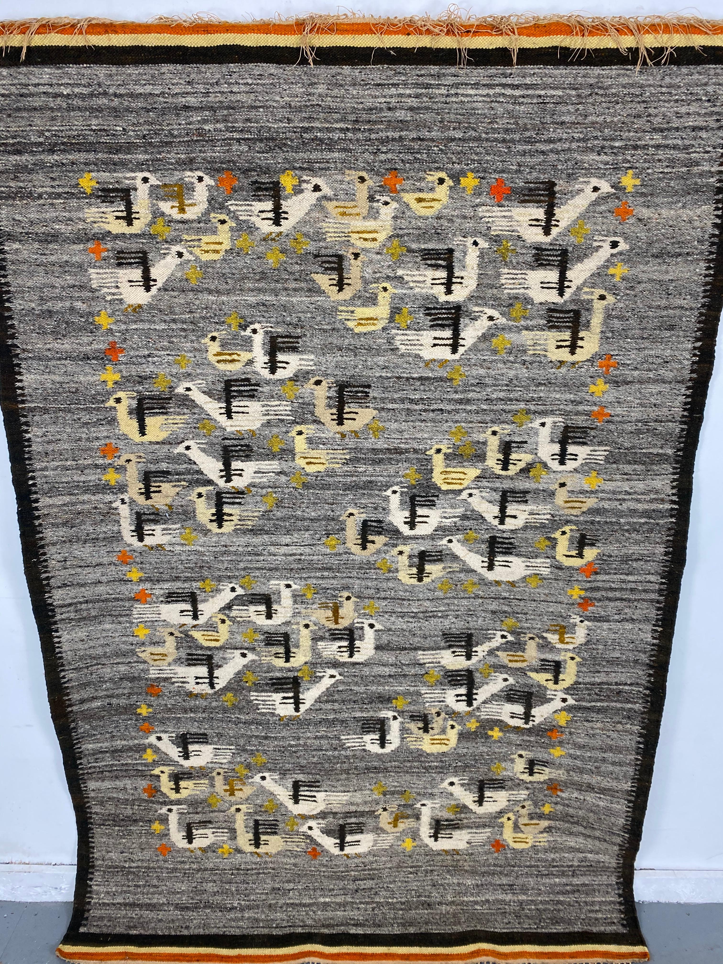 Handwoven midcentury Swedish rug or wall hanging with stylized bird design, this weaving has been set up as a wall hanging,
Size: 49