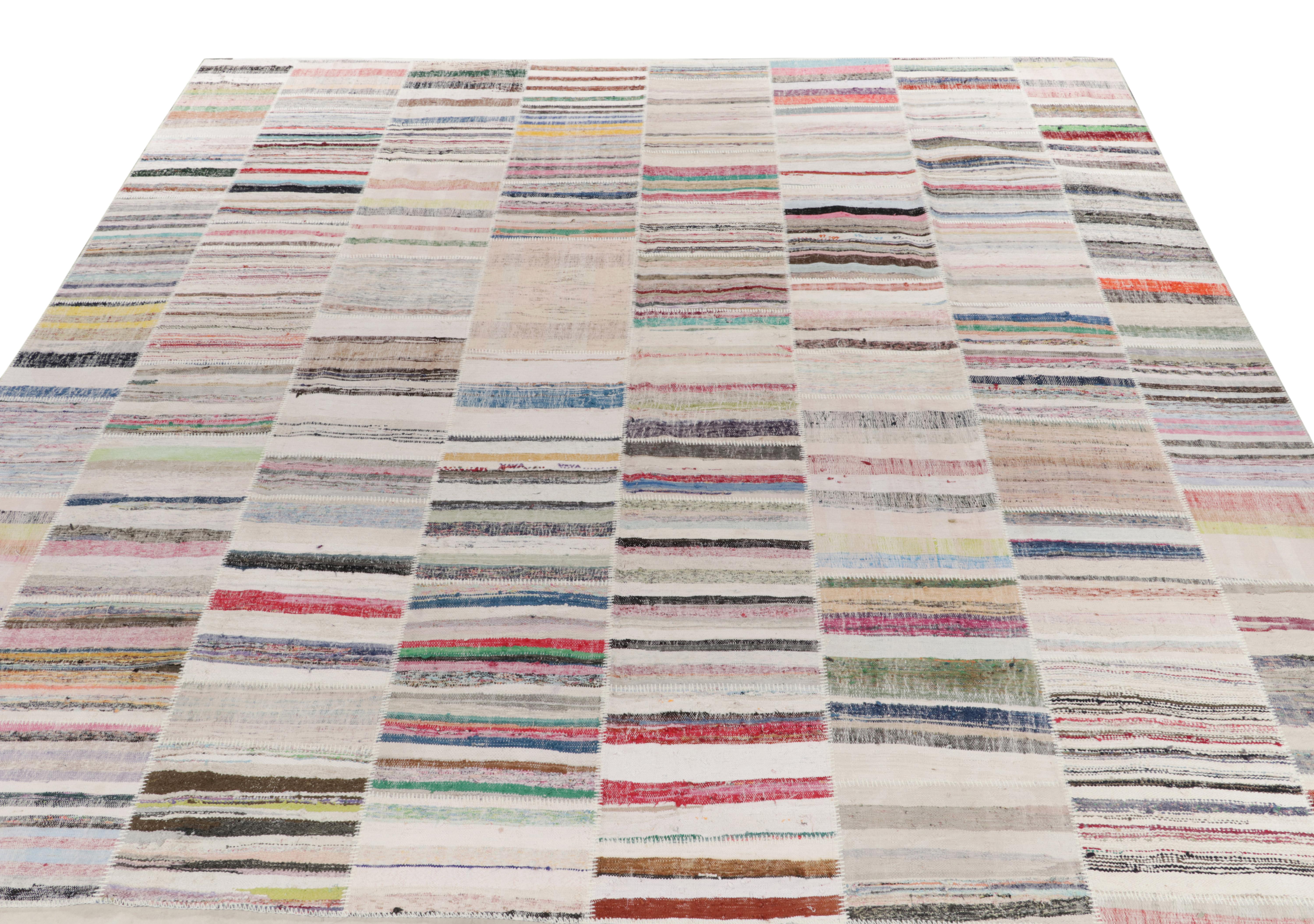 Rug & Kilim takes pride in presenting its artistic vision of patchwork kilim that reimagines vintage yarns into unique pieces of art. This square 14x14 flat weave features a striated pattern that lends a whimsical, colorful sense of movement in