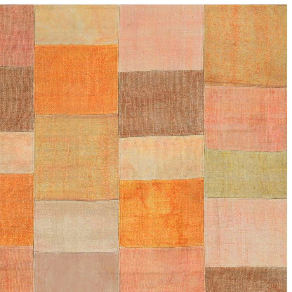 End-20th Century Handwoven Earth Tones Patchwork Kilim Carpet

 Originating from Persia, this modern geometric woolen Kilim pays homage to transitional patchwork designs from various rug making cultures in its pattern and colorways. Flat-woven in