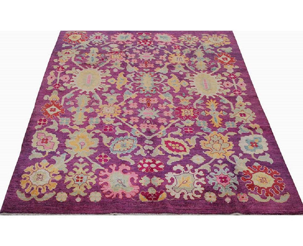 This traditional handwoven Persian Sultanabad rug has been recreated from an antique design.  Handwoven in modern-day Iran, this elegant piece is a compelling work of art for the interior designer wanting a simple but striking foundation for their