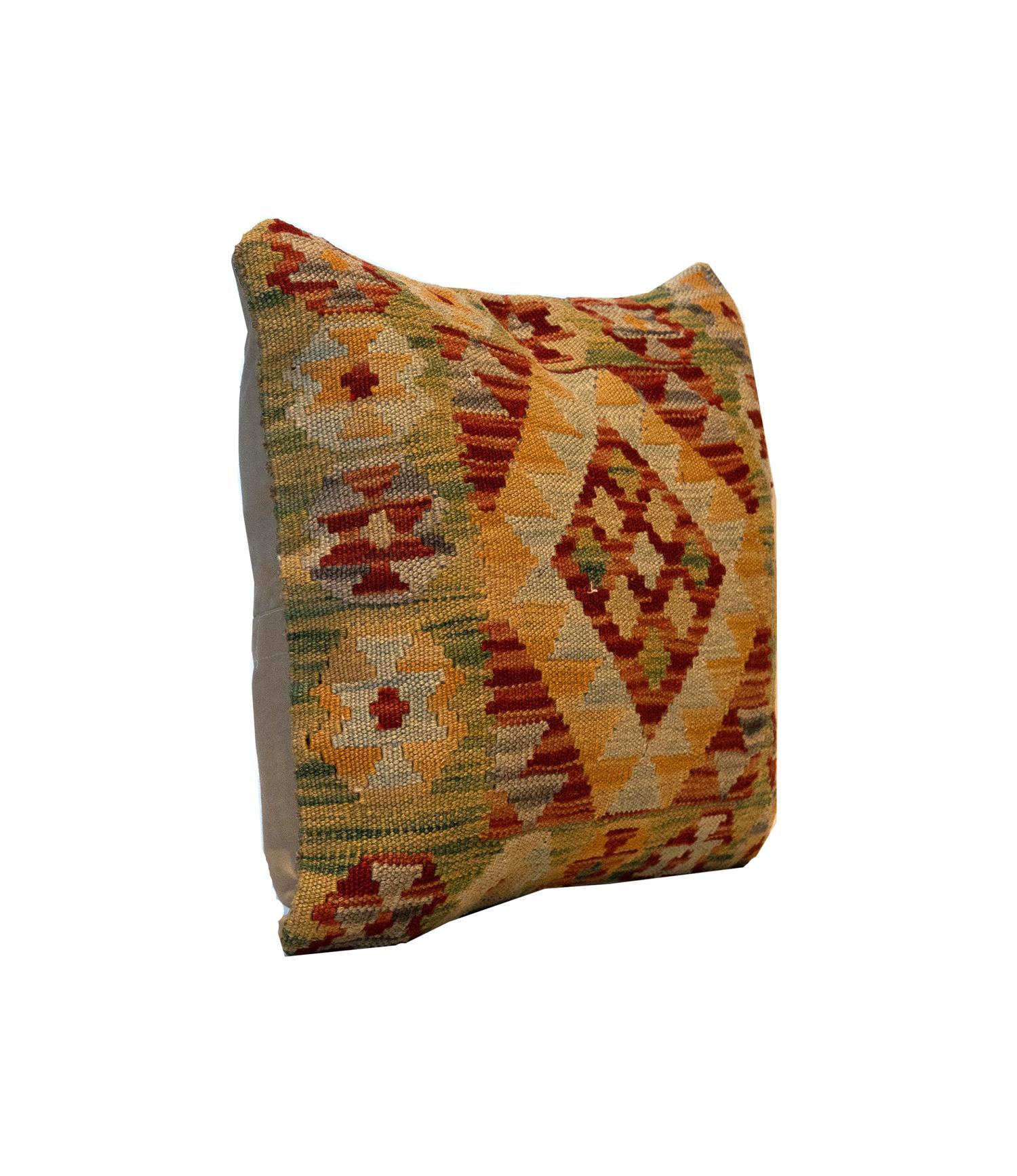 This Traditional Geometric Kilim cushion cover has been handwoven with the traditional Kilim, flat-weave technique. Featuring a geometric pattern woven in brown, red, blue, green and mustard. Decorate your bed, sofa or armchair with this fantastic