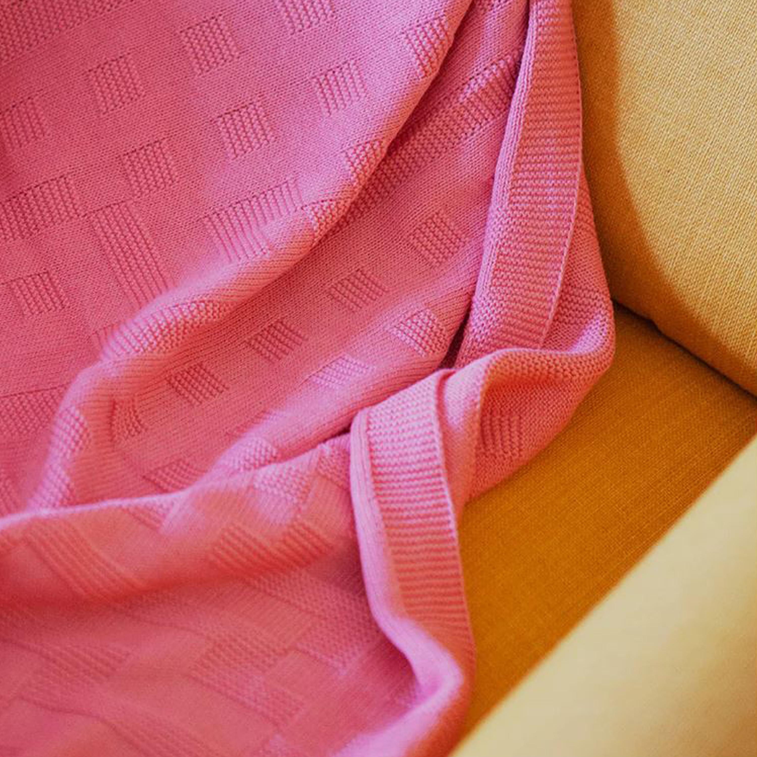 Hand-woven Pink throw designed by Cristian Zuzunaga, made of high-quality cotton with Marino wool. It features a left-stitching knitting technique with a 3-D effect. Its inspiration comes from a picture taken from one of Tokyo's most emblematic