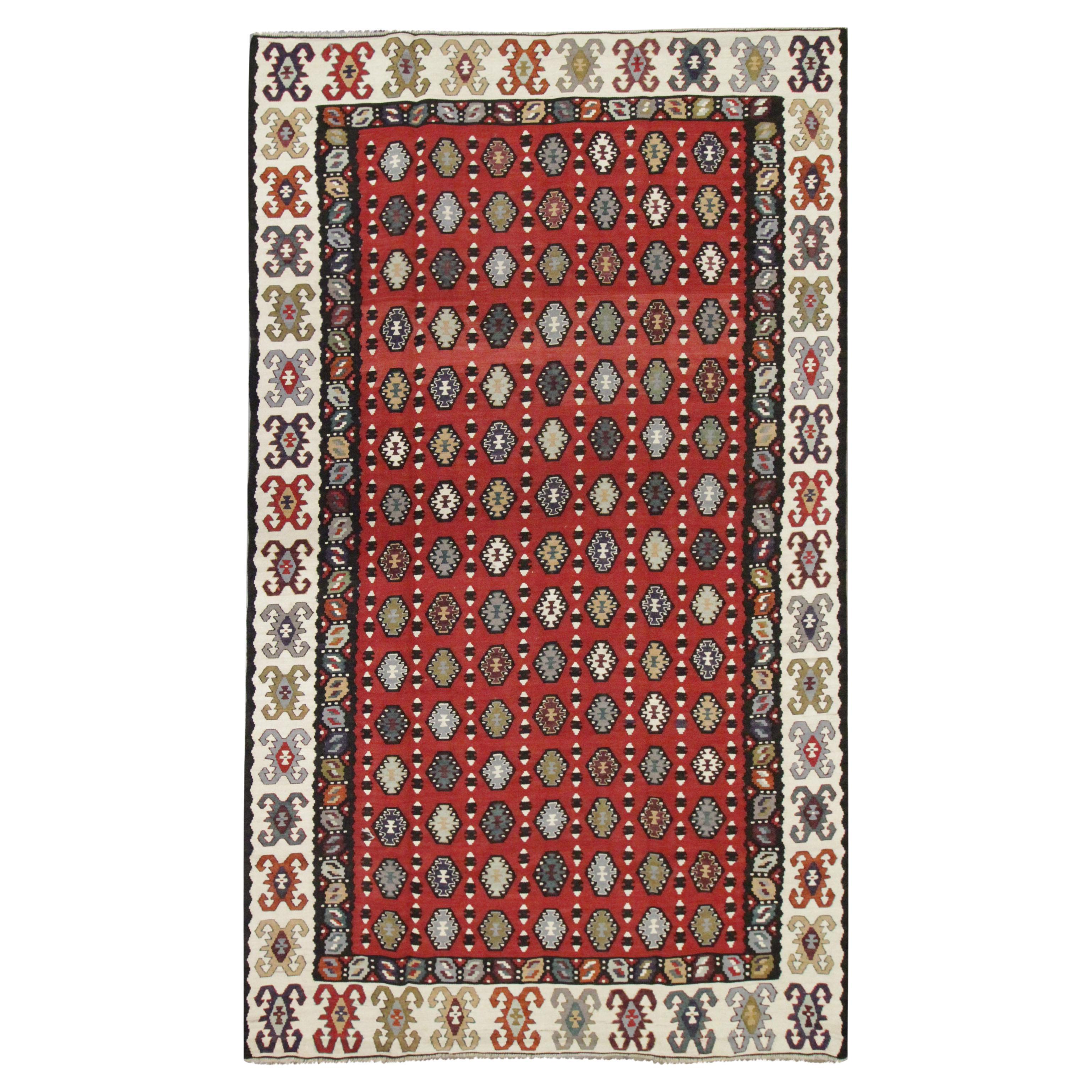 Tapis oriental Kilim géométrique tissé à la main en laine rouge rayé