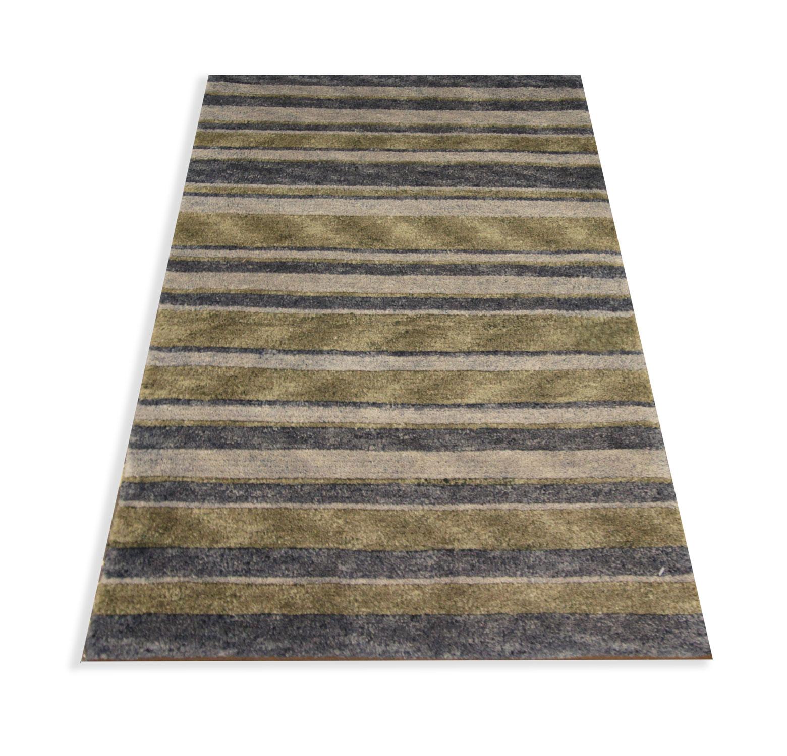 This handwoven wool area rug is a modern carpet woven with a simple stripe pattern. Featuring green and grey accent colours. The construction and materials used are of the highest quality, including hand-spun wool and cotton that has been