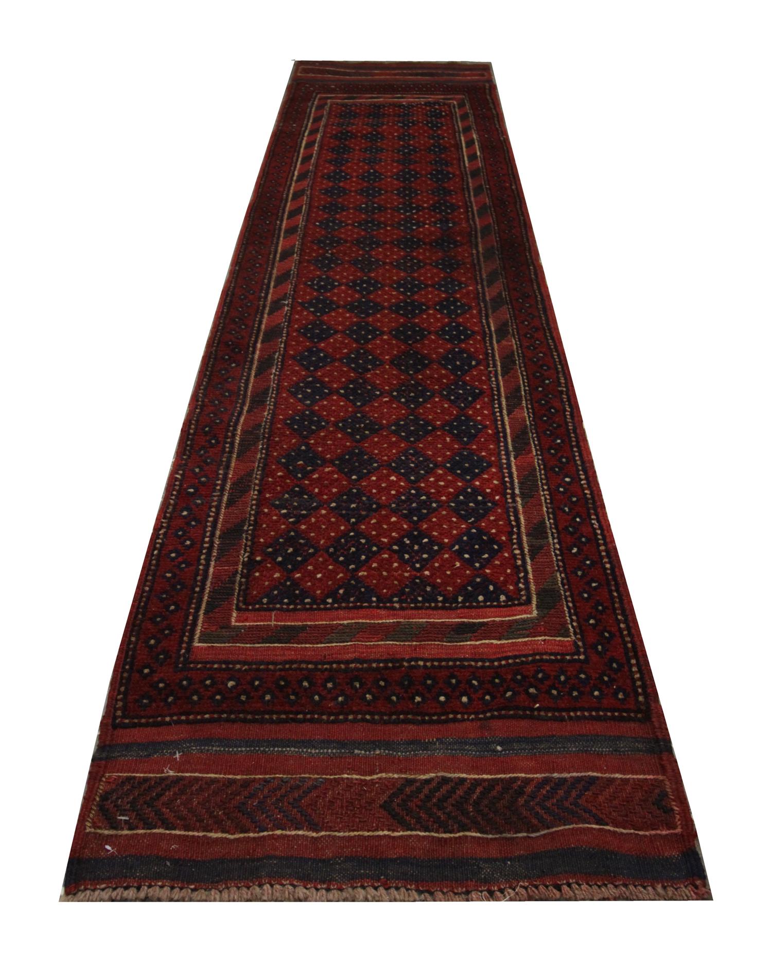This fine wool runner rug features a bold design with deep red background with a geometric design covering the centre. A layered border has then framed this. 
The colour and design in this elegant piece make it the perfect accent accessory for any