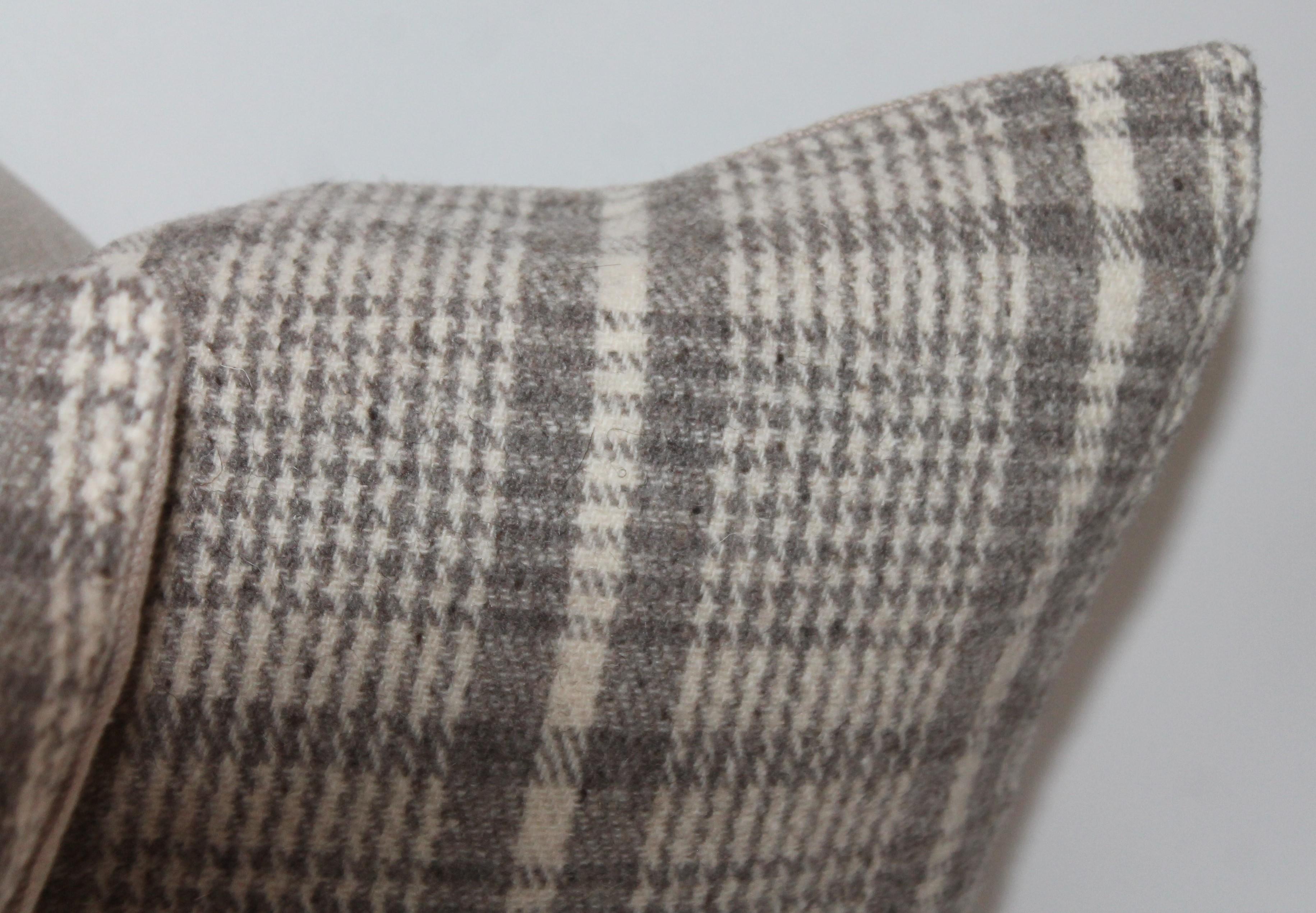 This collection of the four handwoven saddle blanket pillows are in fine condition with a grey linen backings. The soft wool face is fine to the touch. Sold as a collection of four.