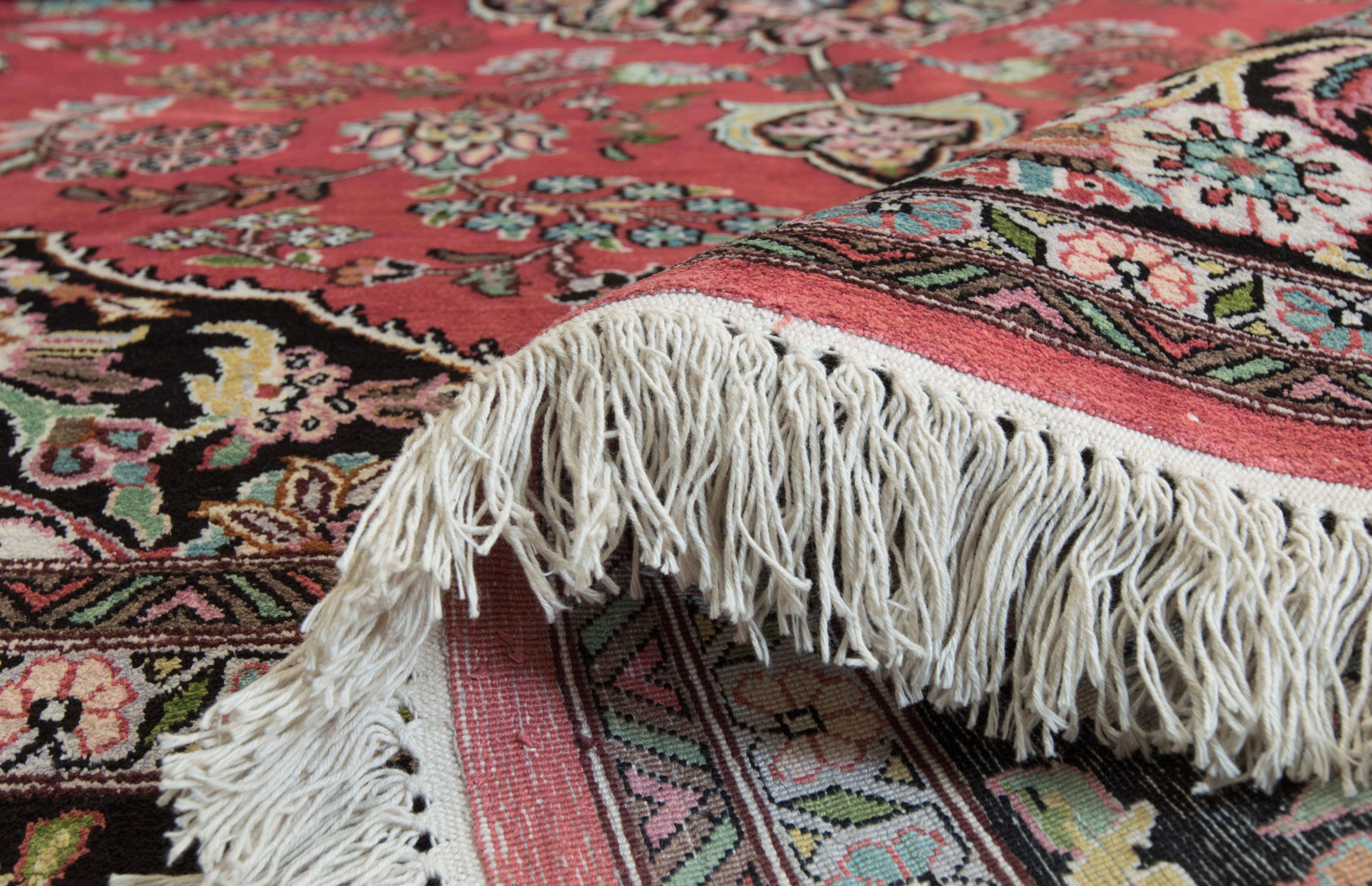 Created in Kashmir, this beautiful rug is made of man-made silk and it features the decorative Persian Tabriz design and a super soft and silky feeling pile. 100% acrylic pile. Brand new.
 