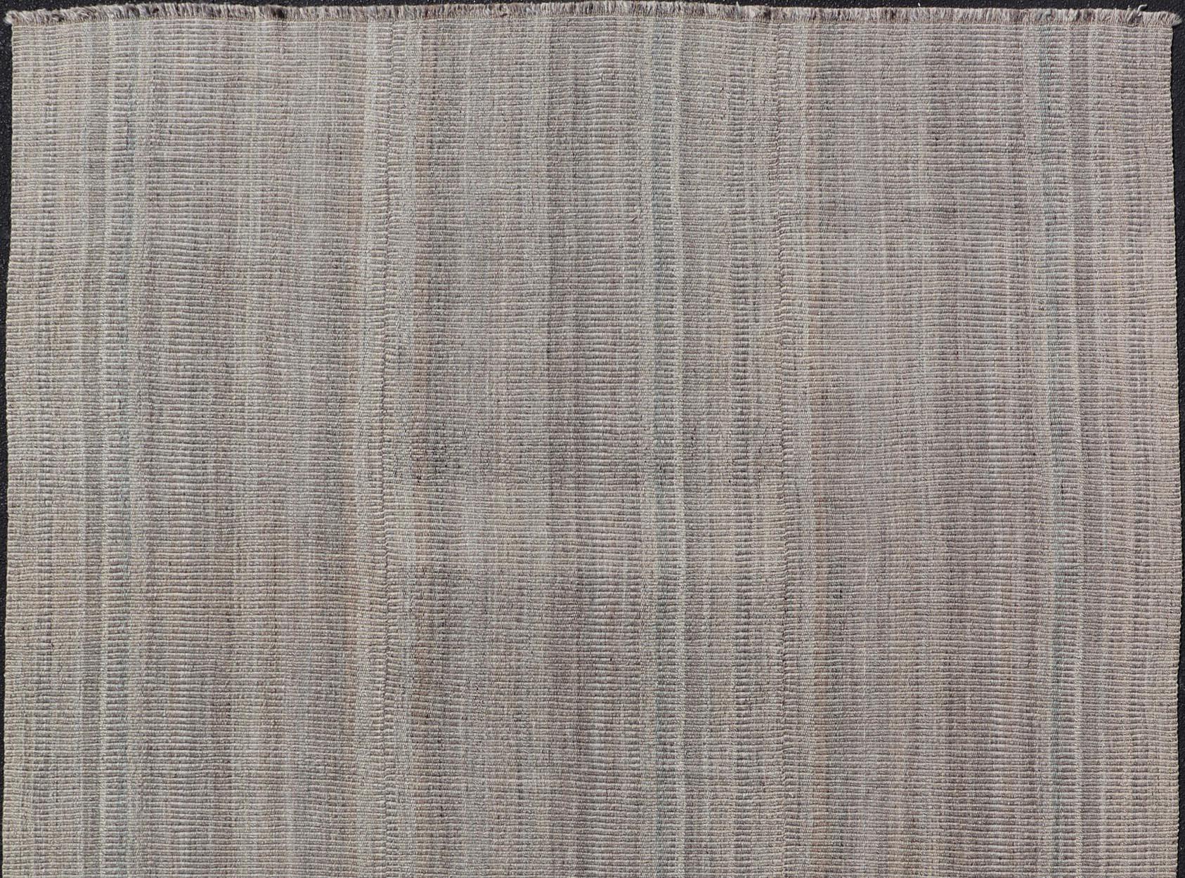Measures: 9'3 x 12'4. 
Handwoven Textured Kilim Rug in Soft Gray and Light Blue Tones 9'3 x 12'4. 
Keivan Woven Arts / rug/VLM-7689, country of origin / type: Iran / Kilim, circa 21st Century. 

Showcasing a beautifully textured flat-weave