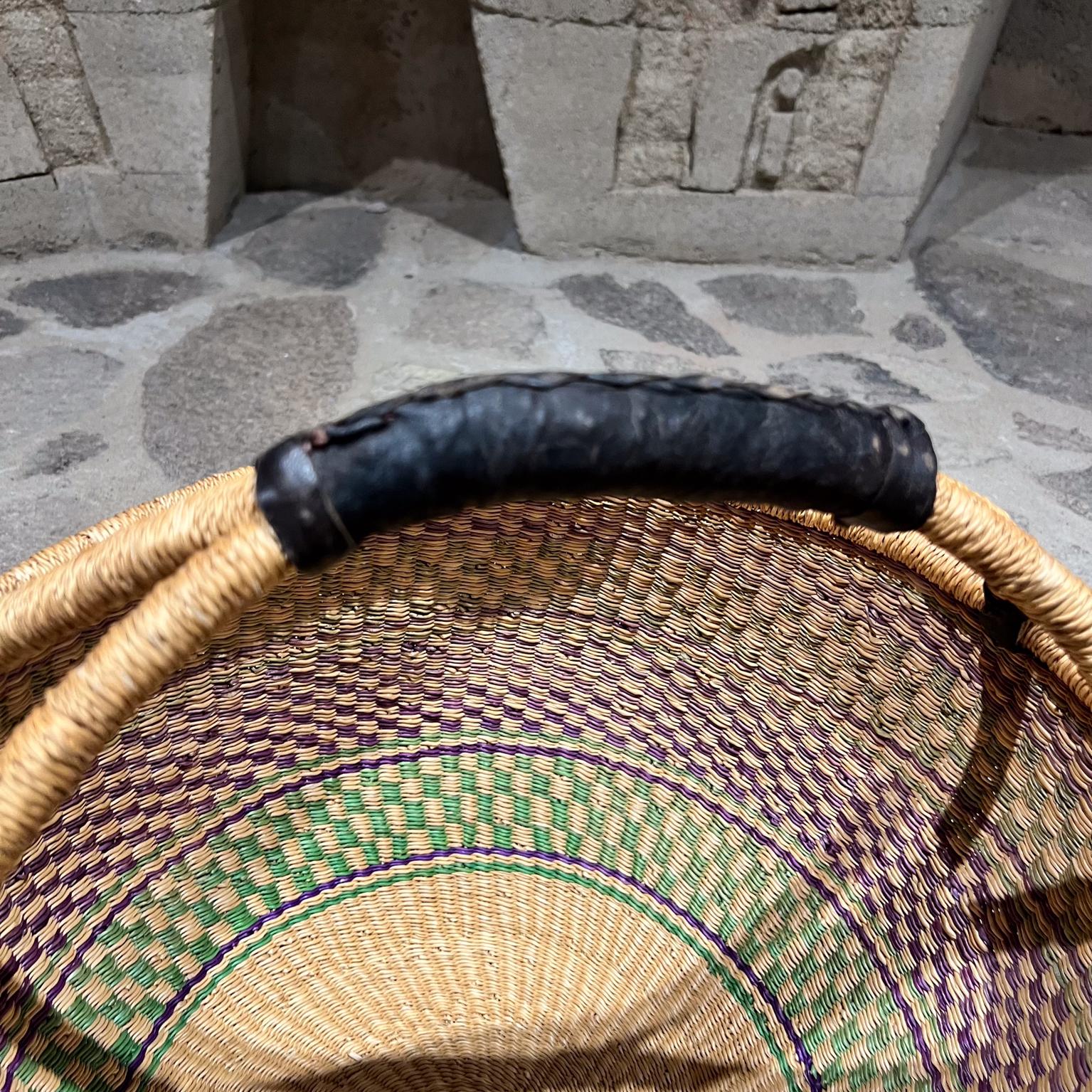 Handwoven Traditional African Bolga Farmer's Market Basket 
Hammered natural fiber weave, patina is present.
14.25 h to top handle x 16 diameter
Unmarked
Preowned original vintage condition
Refer to images