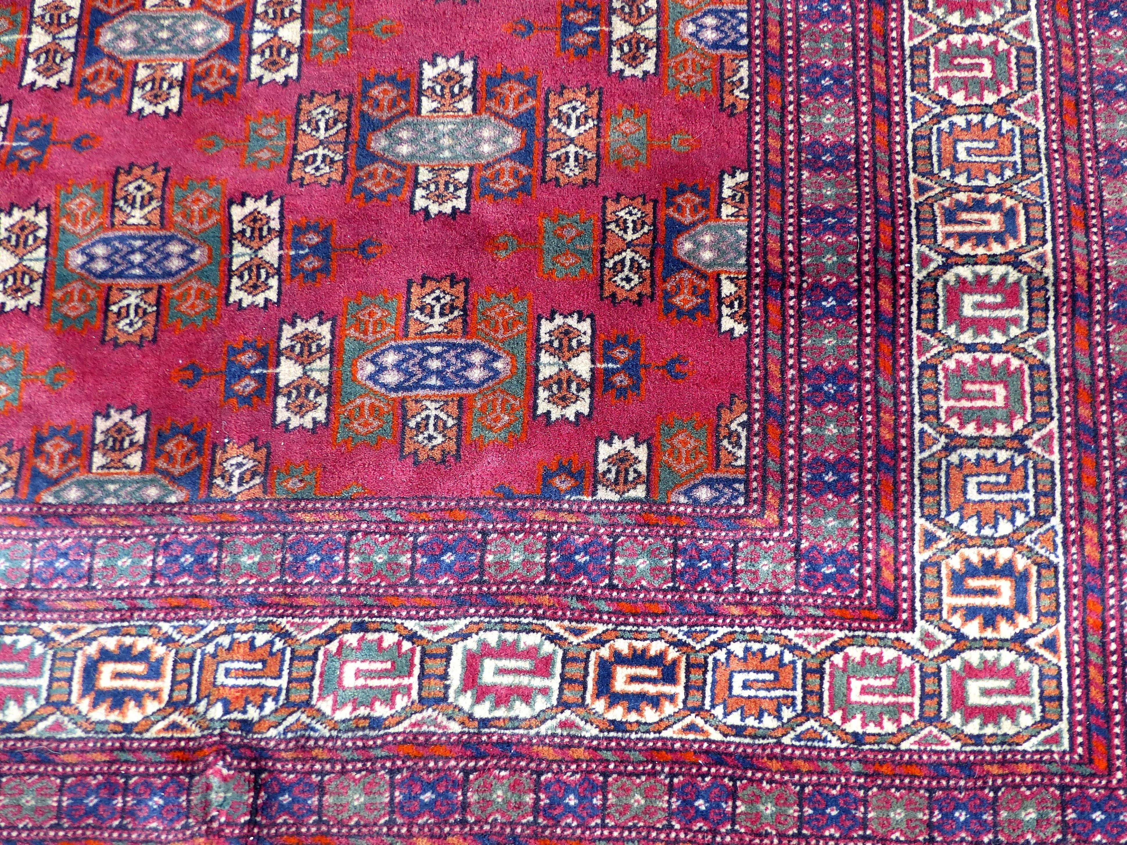 Handwoven Turkoman Armenian Wool and Silk Carpet, Mid-20th Century

Offered for sale is a fine quality Armenian Turkoman wool and silk handwoven rug with vibrant colors, detailed pattern and fringe.