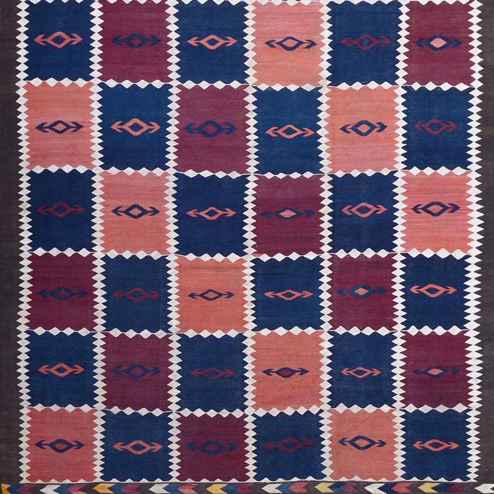 End-20th Century Handwoven Checkered Blue Red Kilim Carpet

Wonderfully graphic and suitable for many furnishing styles is this Kilim. Modern designs are often based on traditional motifs and symbols and reinterpret them. This fantastic abstract