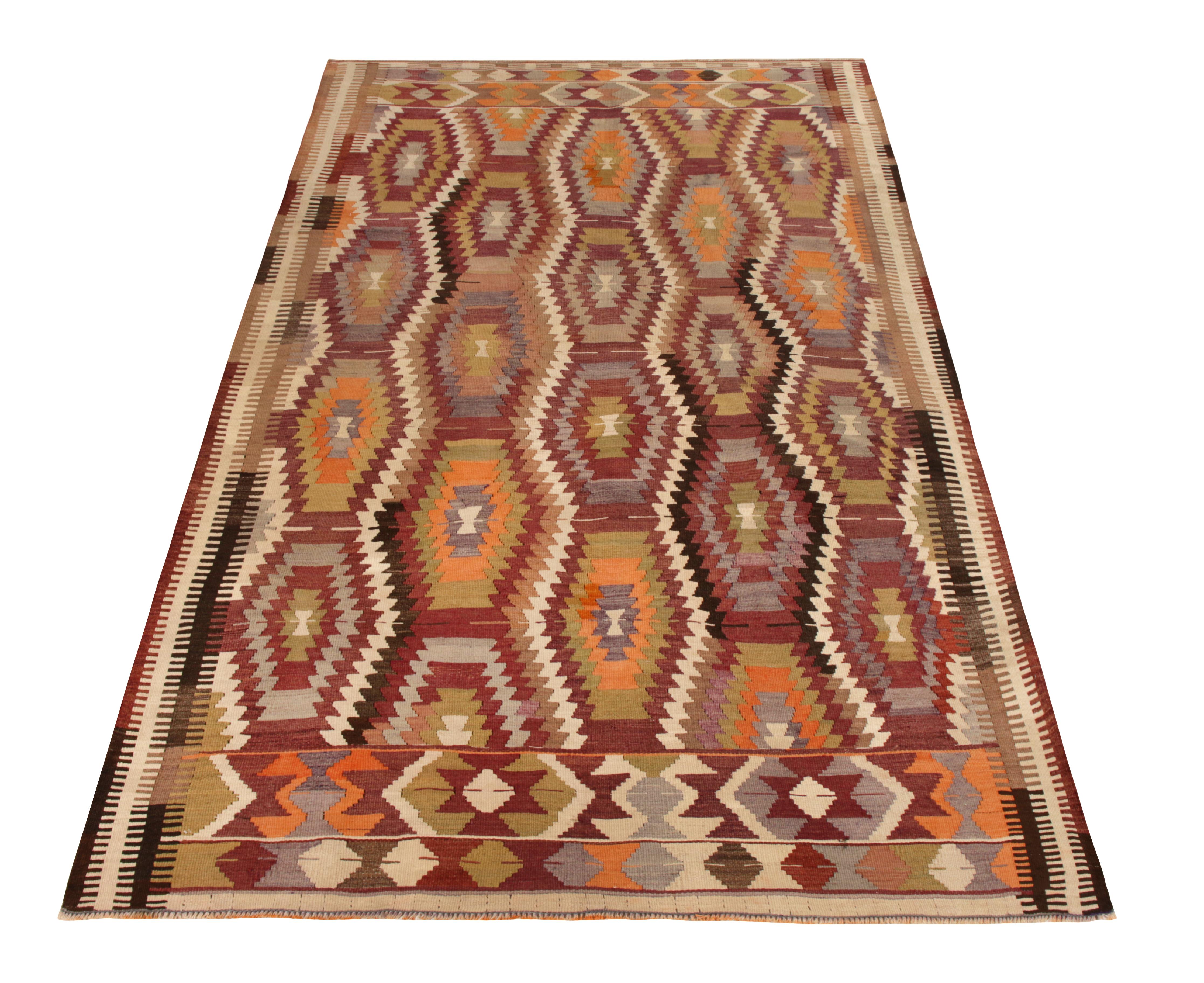 Connoting the 1950s-1960s Turkish Antalya style, this 5x9 vintage Kilim rug joins the mid-century selections in Rug & Kilim’s renowned Kilim & Flat Weave lines. Handwoven in wool, this tribal Kilim style stands out in a bold all over geometric