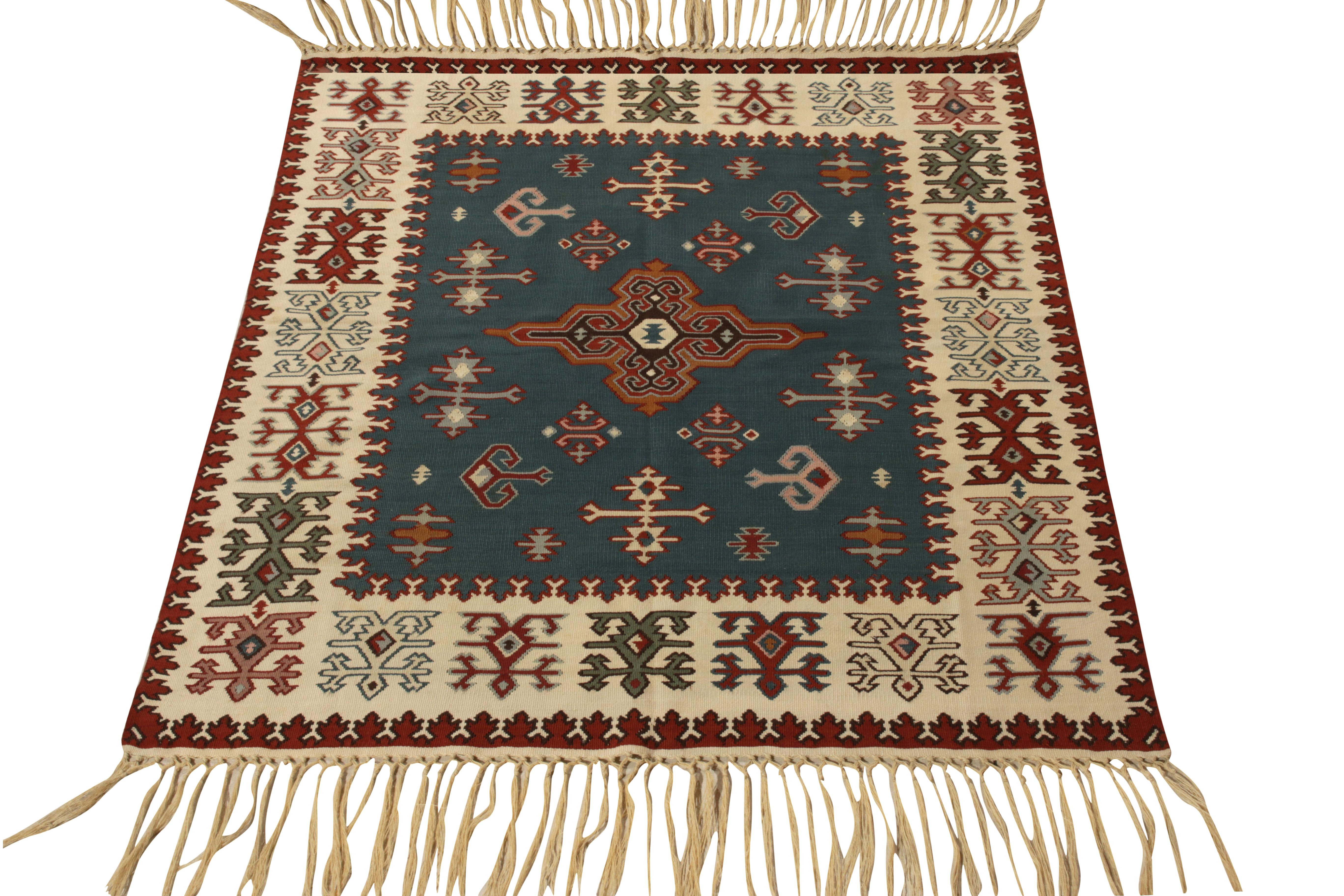 A sophisticated 4x5 Balkan piece, idyllic for an array of traditional and modern projects from Rug & Kilim’s vintage flatweave repertoire. Belonging to Turkey circa 1950-1960, the weave poses in rustic aesthetics with tribal motifs in comforting