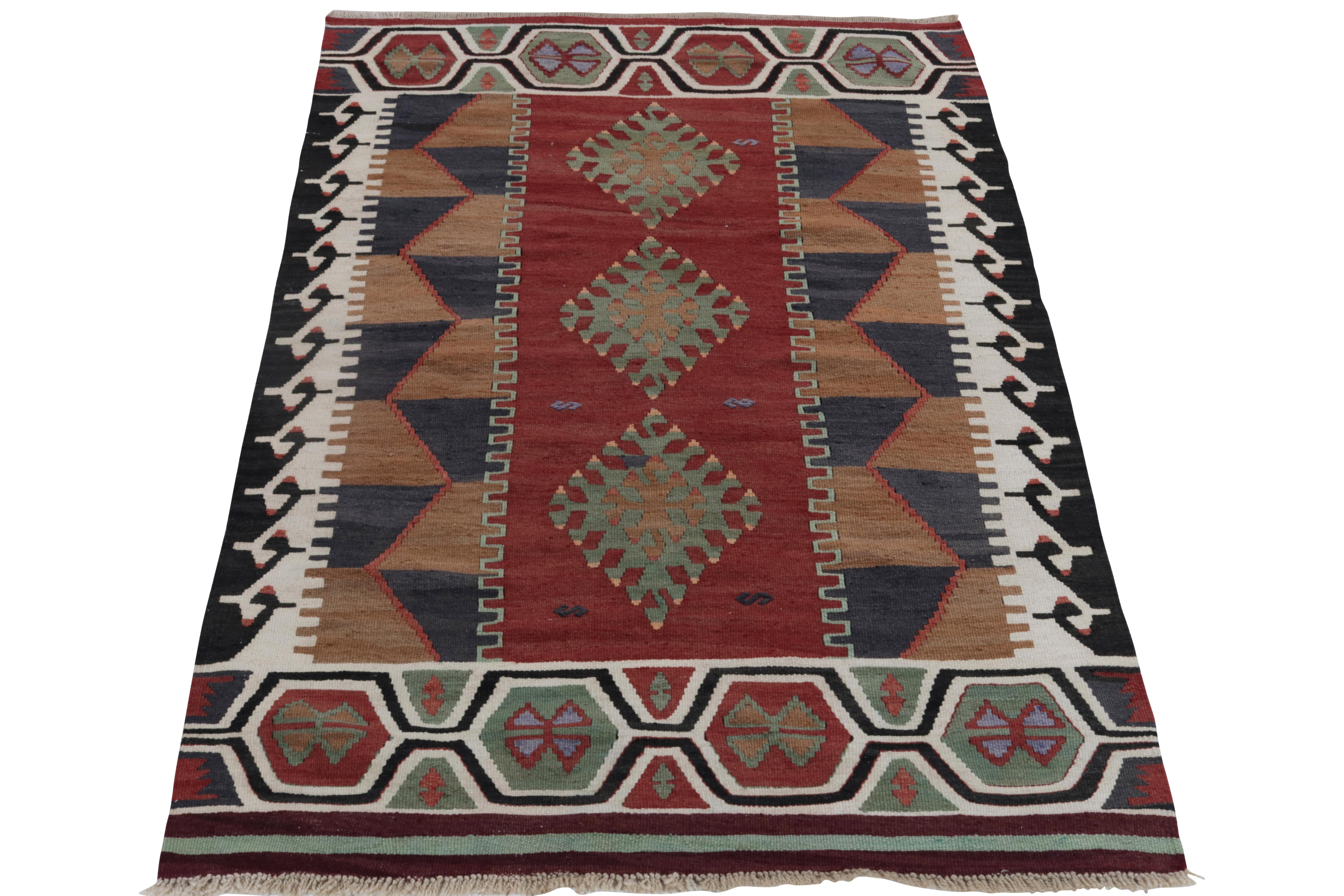 Handwoven in fine yarn, a 4x6 creation from our vintage Kilim & Flatweave selections. Originating from Persia around the 1950s, the mid-century rug enjoys a well defined geometric pattern emanating mid century sensibilities in an interesting color