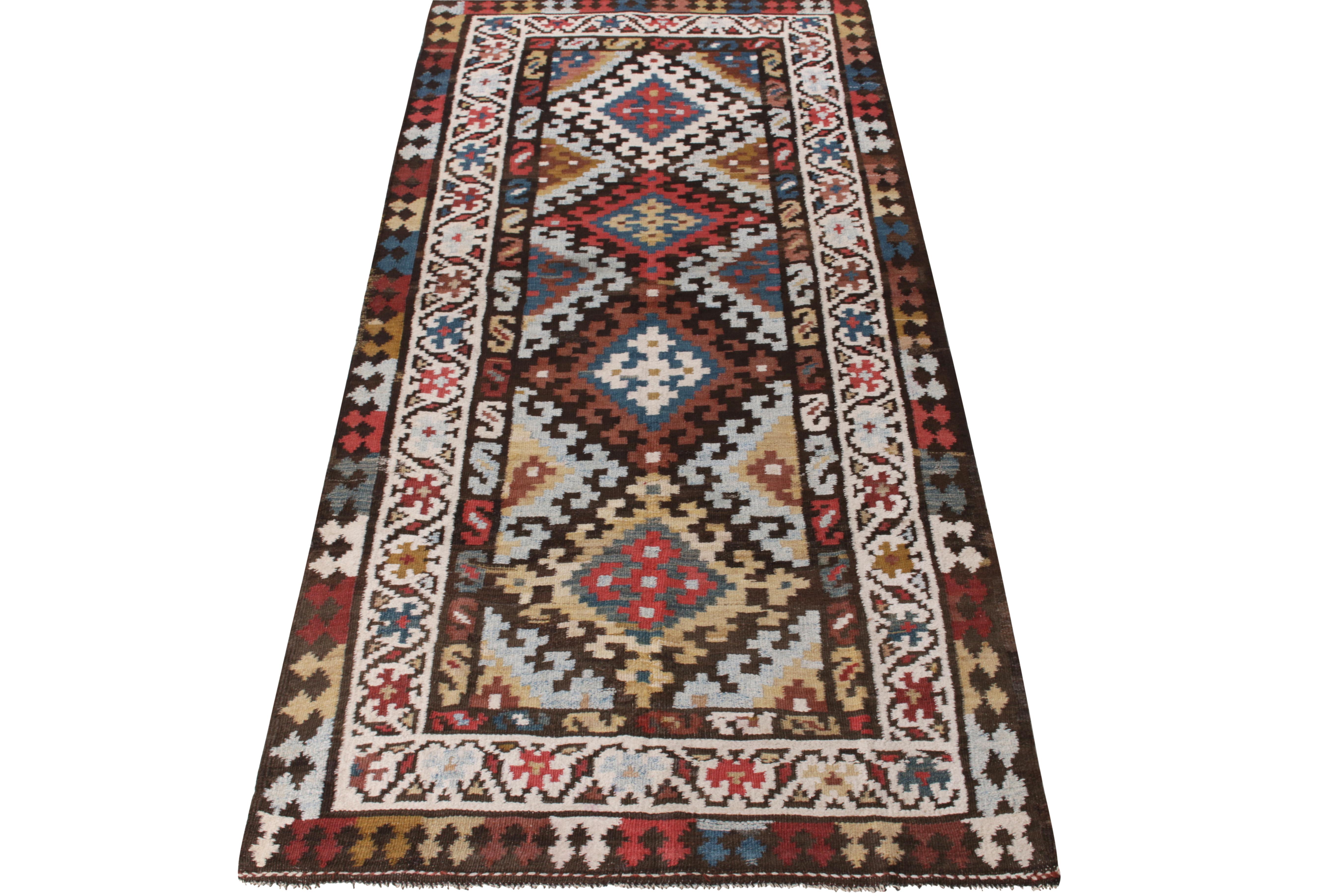 A rustic vintage Kilim gallery rug enjoying nomadic sensibilities entering our Kilim & Flatweave collection. Relishing tribal motifs in a traditional colorway of variegated tones, joyfully gracing the bold geometric pattern - together glorifying