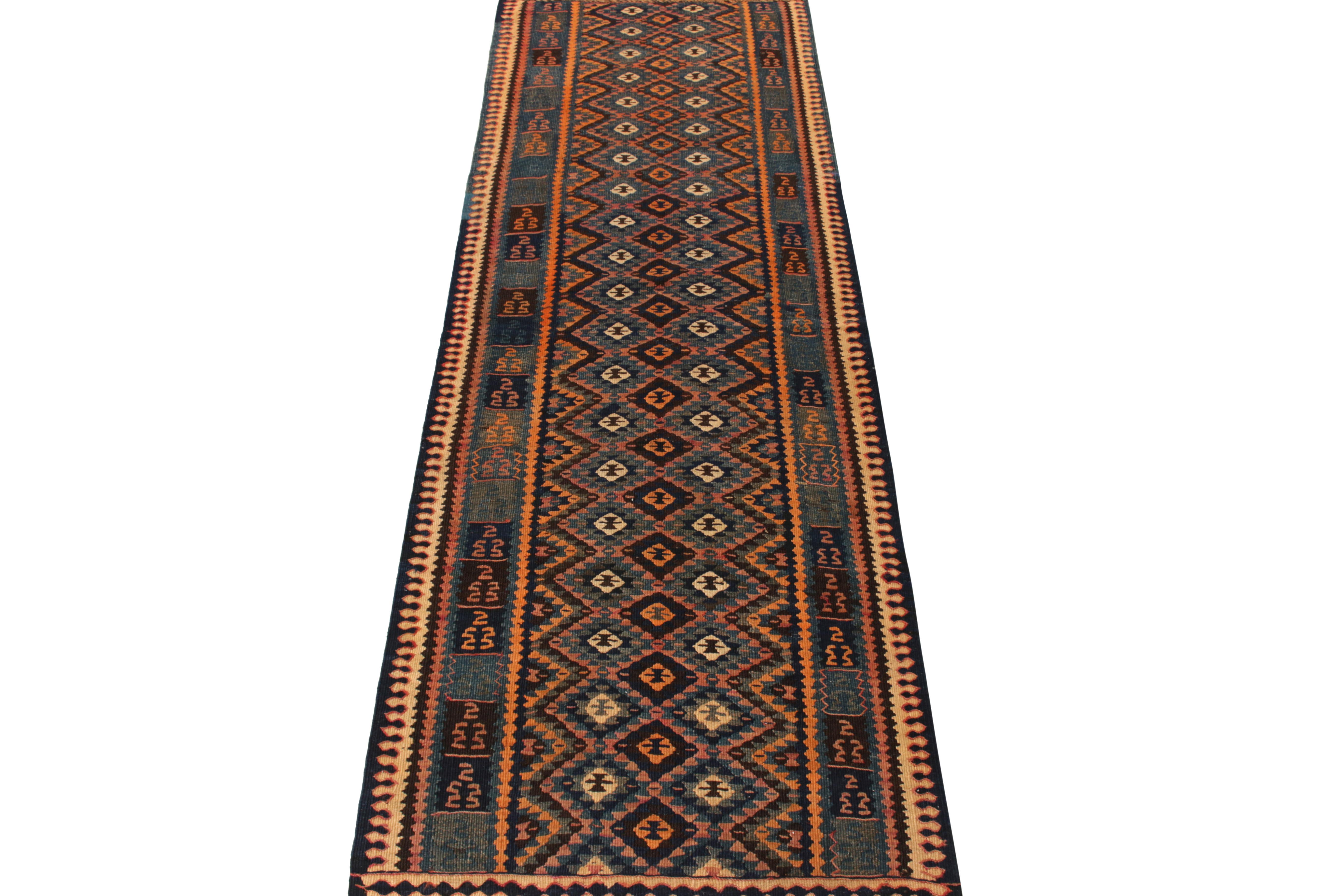 A 3 x 10 handwoven vintage Kilim runner from Turkey circa 1950-1960, amongst Rug & Kilim’s fine selections of Classic flatweaves. The piece displays a montage of symmetric chevrons, diamond patterns and nomadic motifs in a rare colorway of gold,