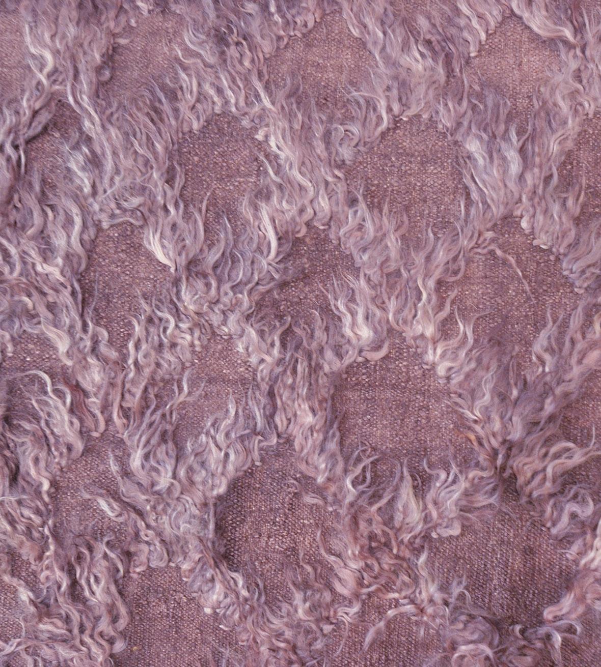 Part of the Mansour Modern collection, this handwoven rug has a mauve field with an overall mohair tufted trellis.