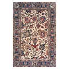 Tabriz persiano in lana intrecciata a mano con motivi floreali multicolore, circa fine XIX secolo