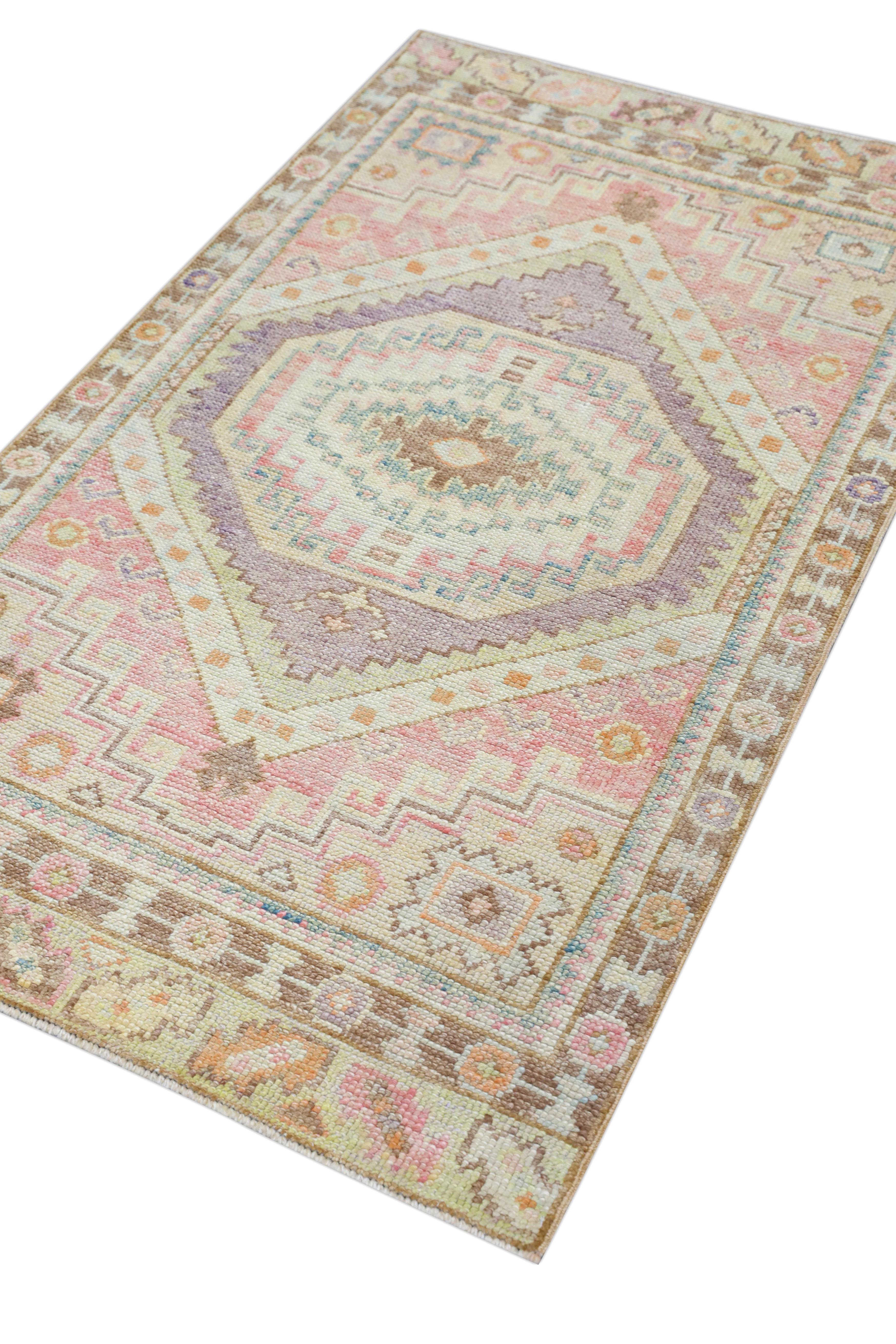 This Turkish oushak rug is a stunning piece of art that has been handwoven using traditional techniques by skilled artisans. The rug features intricate patterns and a soft color palette that is achieved through the use of natural vegetable