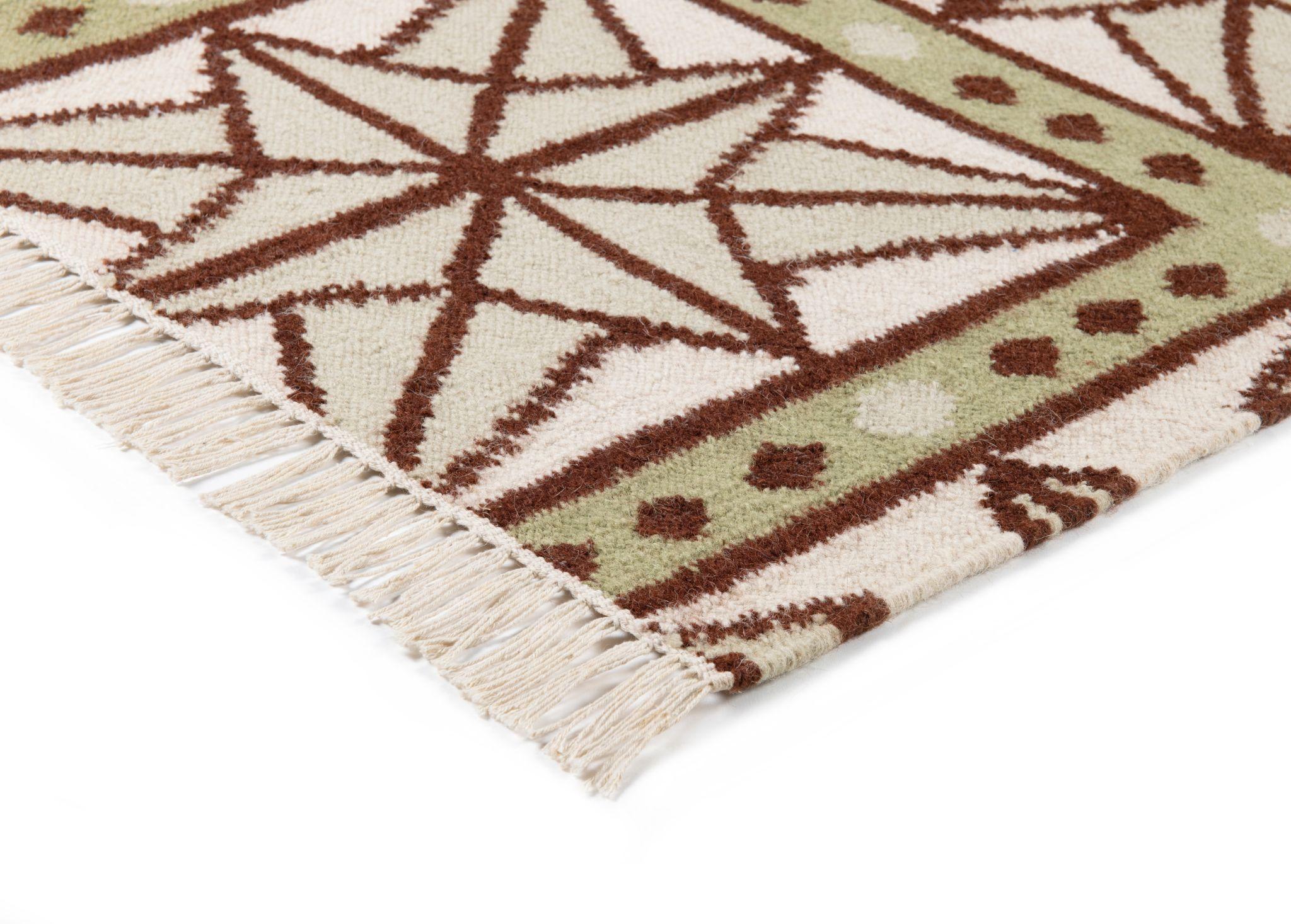 The serene beauty of the Star Rug was inspired by Moroccan tiles and antique American quilts. Symmetrical starbursts interlock in a delicate window pane pattern to create a design that is both ethereal and boldly geometric. Made of 100% New Zealand