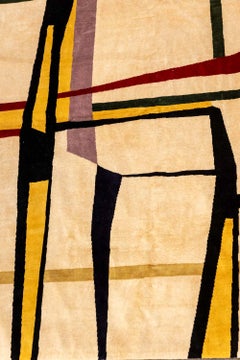 Arazzo in lana tessuto a mano con un motivo geometrico colorato. 2026.