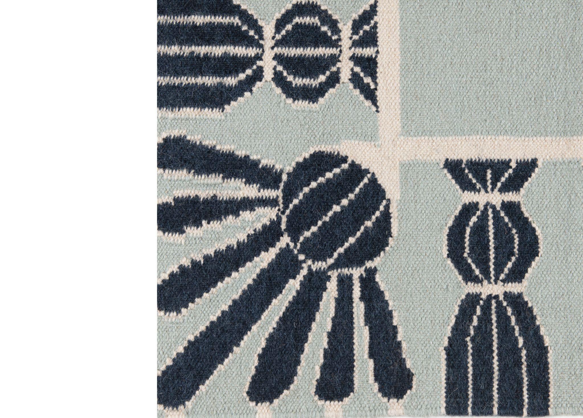 Typically seen on furniture and drapery, tassels are an elegant detail that adds depth and charm to a room. Drawing on the tradition of trompe l'oeil, we've reimagined tassels as a rug border to define and enhance your space. Simple yet striking,