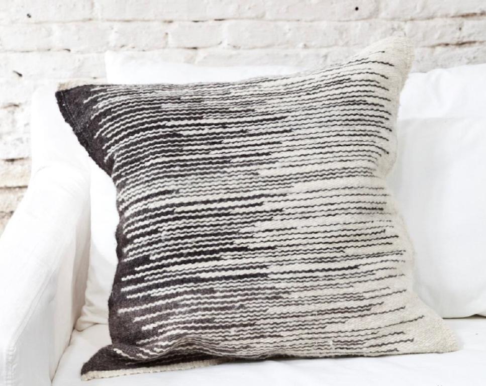 This lovely graphic Parinas style handwoven throw pillow is made from hand spun virgin sheep wool, woven by hand by master weavers who live in the remote area of La Puna, Argentina, using ancestral techniques. The entire process from shearing to