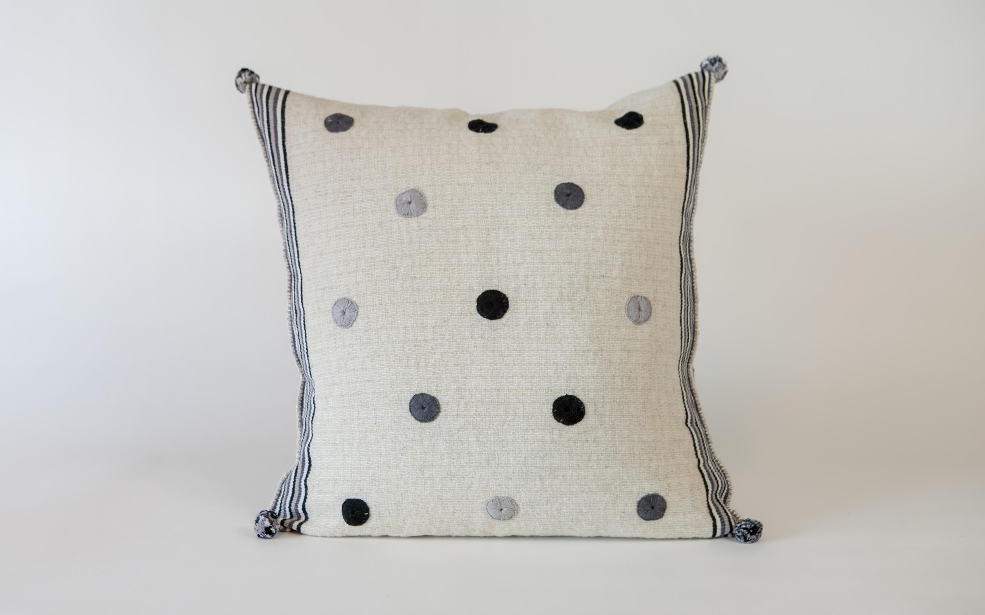 Handwoven on backstrap looms using the same methods used since pre-Colombian times yet designed for the modern home, the fabric of this delightful pillow is made 100% from wool sheared from community sheep, dyed with natural indigo and woven by