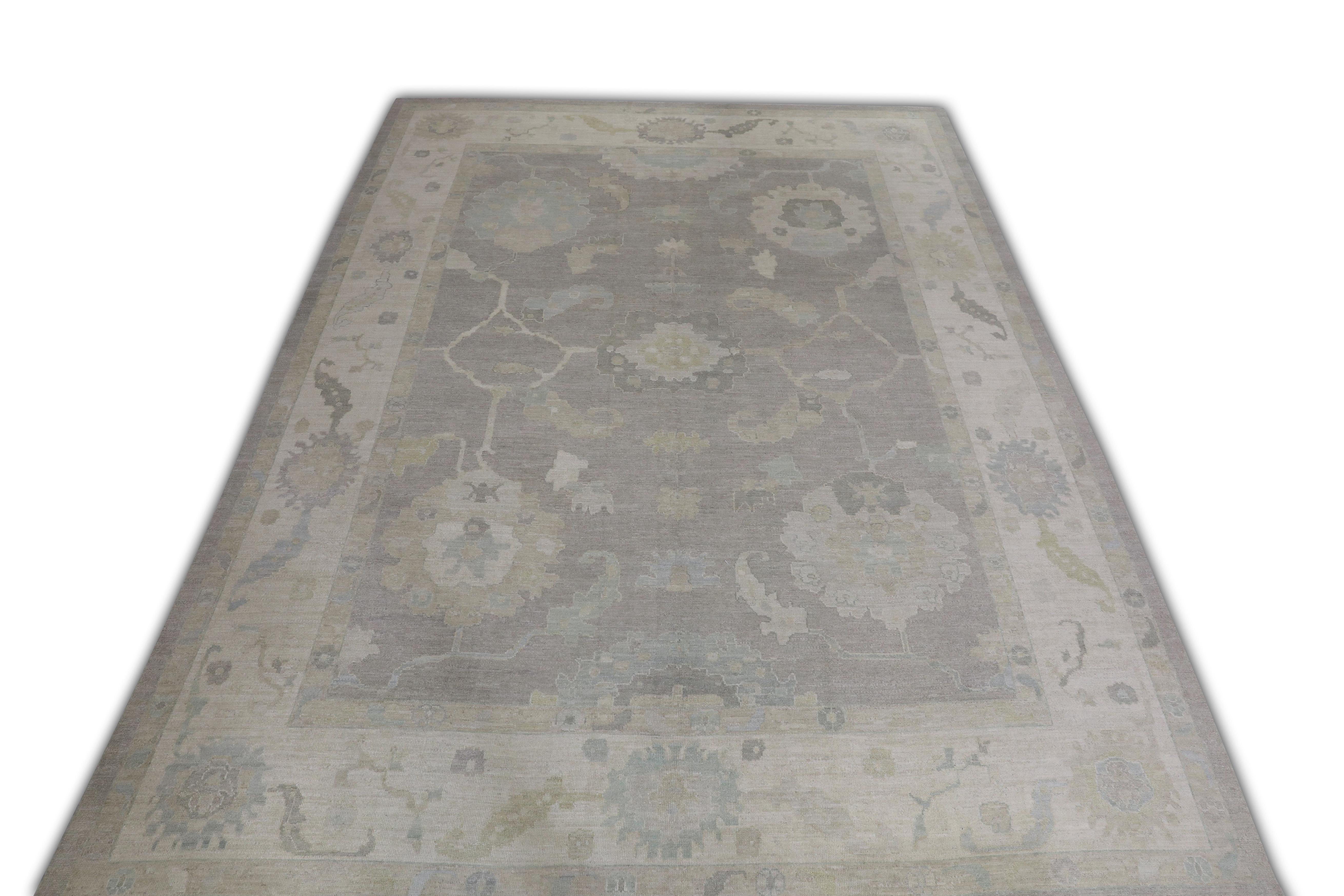 This Turkish oushak rug is a stunning piece of art that has been handwoven using traditional techniques by skilled artisans. The rug features intricate patterns and a soft color palette that is achieved through the use of natural vegetable dyes.