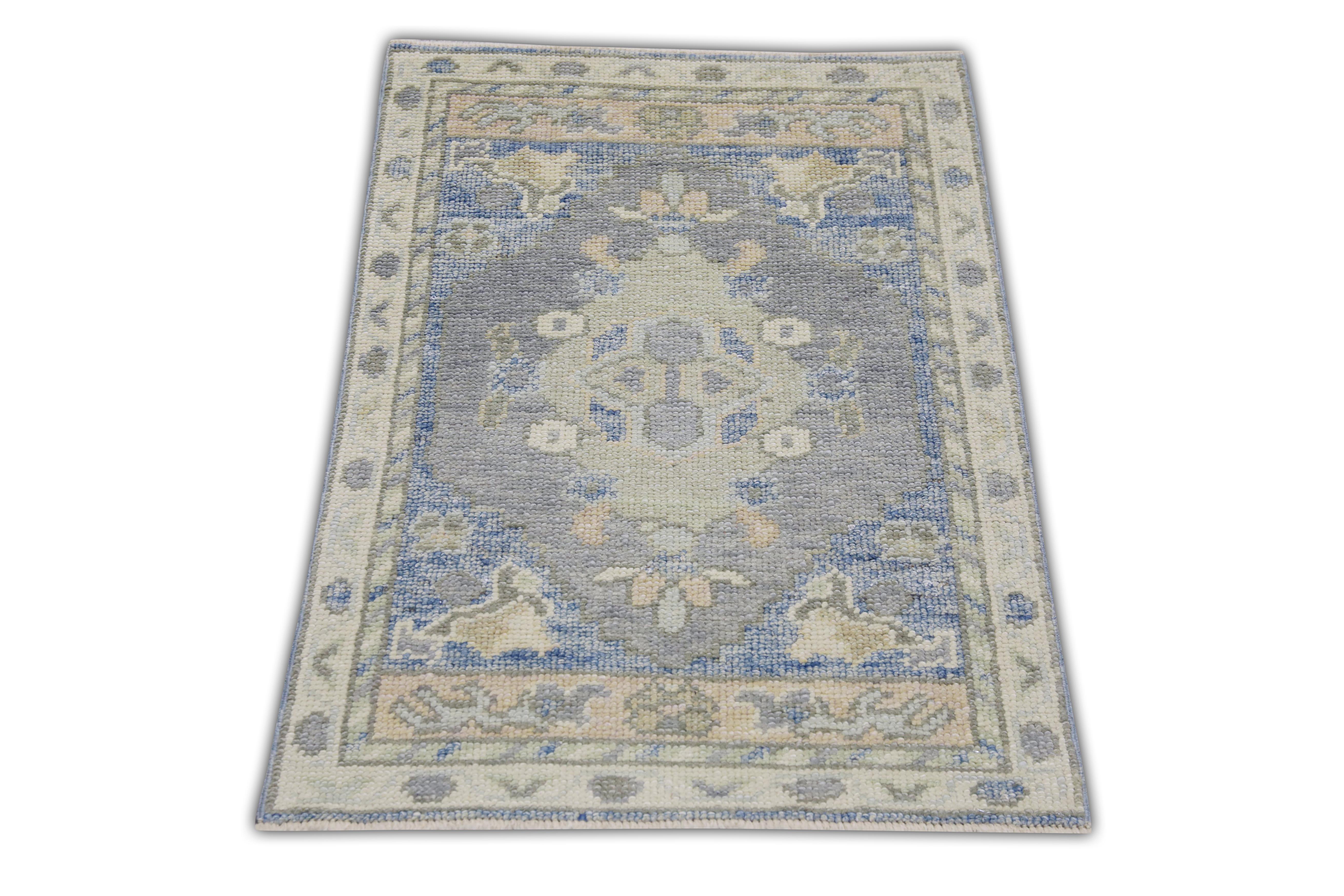 This Turkish oushak rug is a stunning piece of art that has been handwoven using traditional techniques by skilled artisans. The rug features intricate patterns and a soft color palette that is achieved through the use of natural vegetable