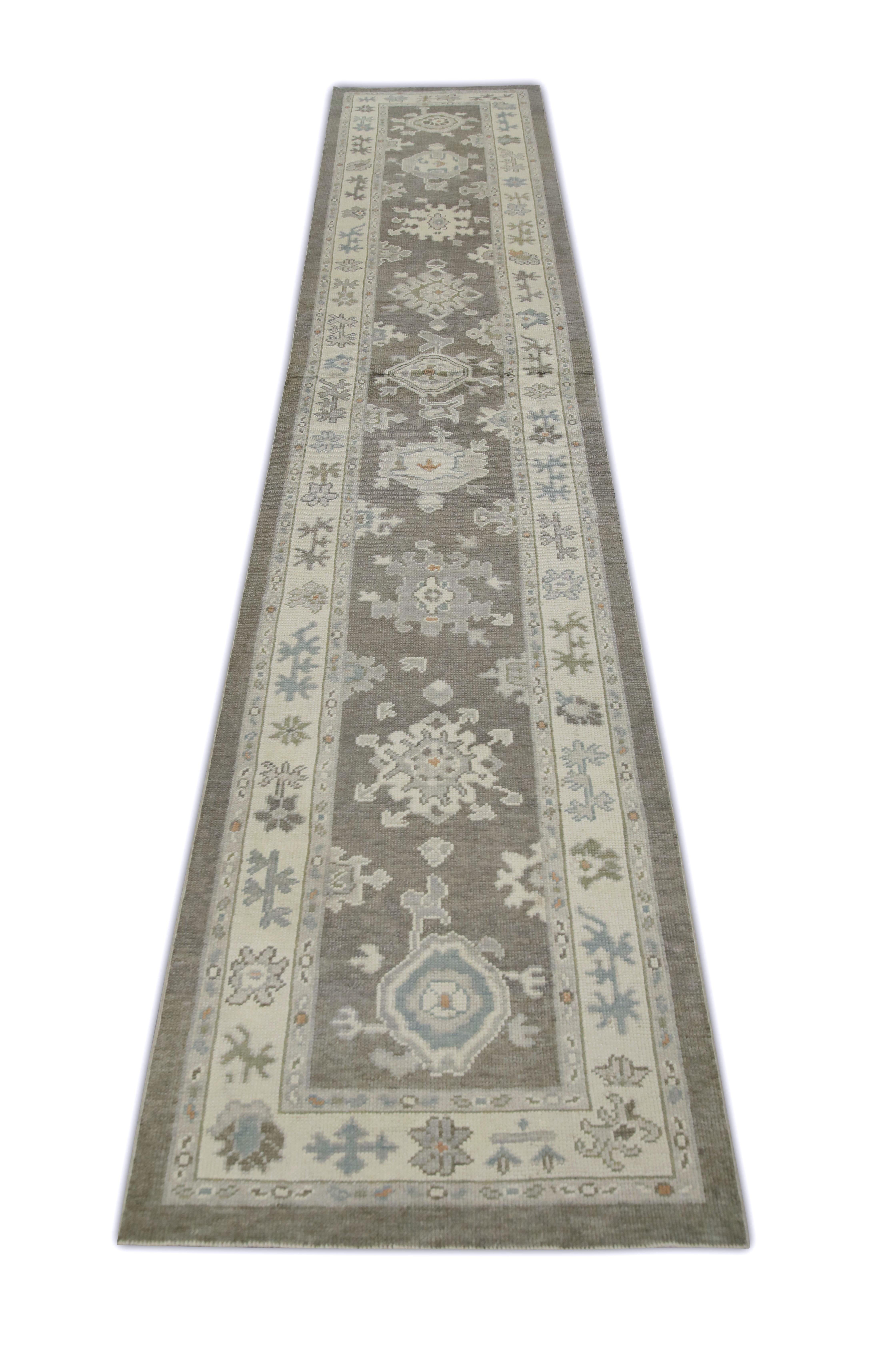 This Turkish oushak rug is a stunning piece of art that has been handwoven using traditional techniques by skilled artisans. The rug features intricate patterns and a soft color palette that is achieved through the use of natural vegetable