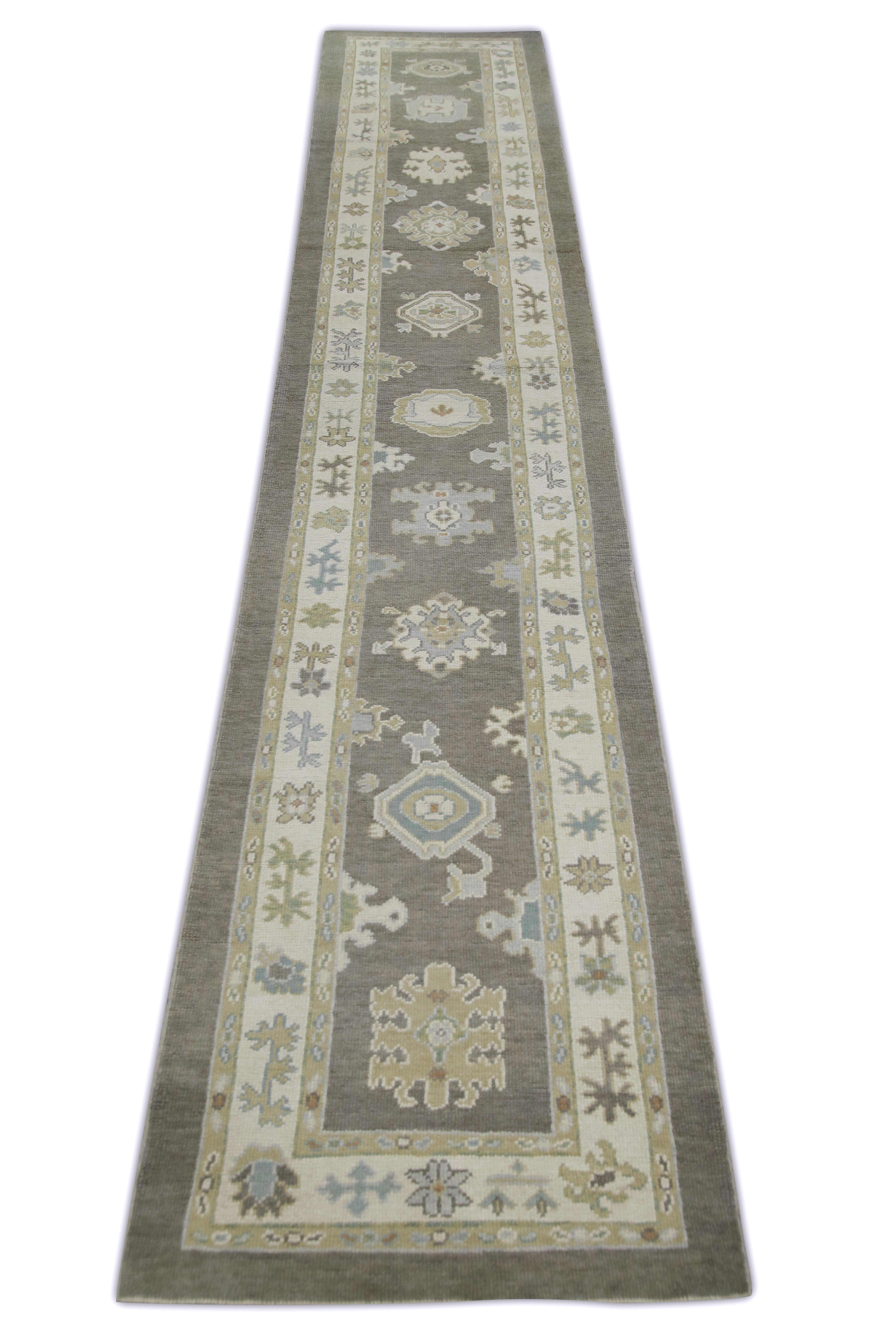 This Turkish oushak rug is a stunning piece of art that has been handwoven using traditional techniques by skilled artisans. The rug features intricate patterns and a soft color palette that is achieved through the use of natural vegetable