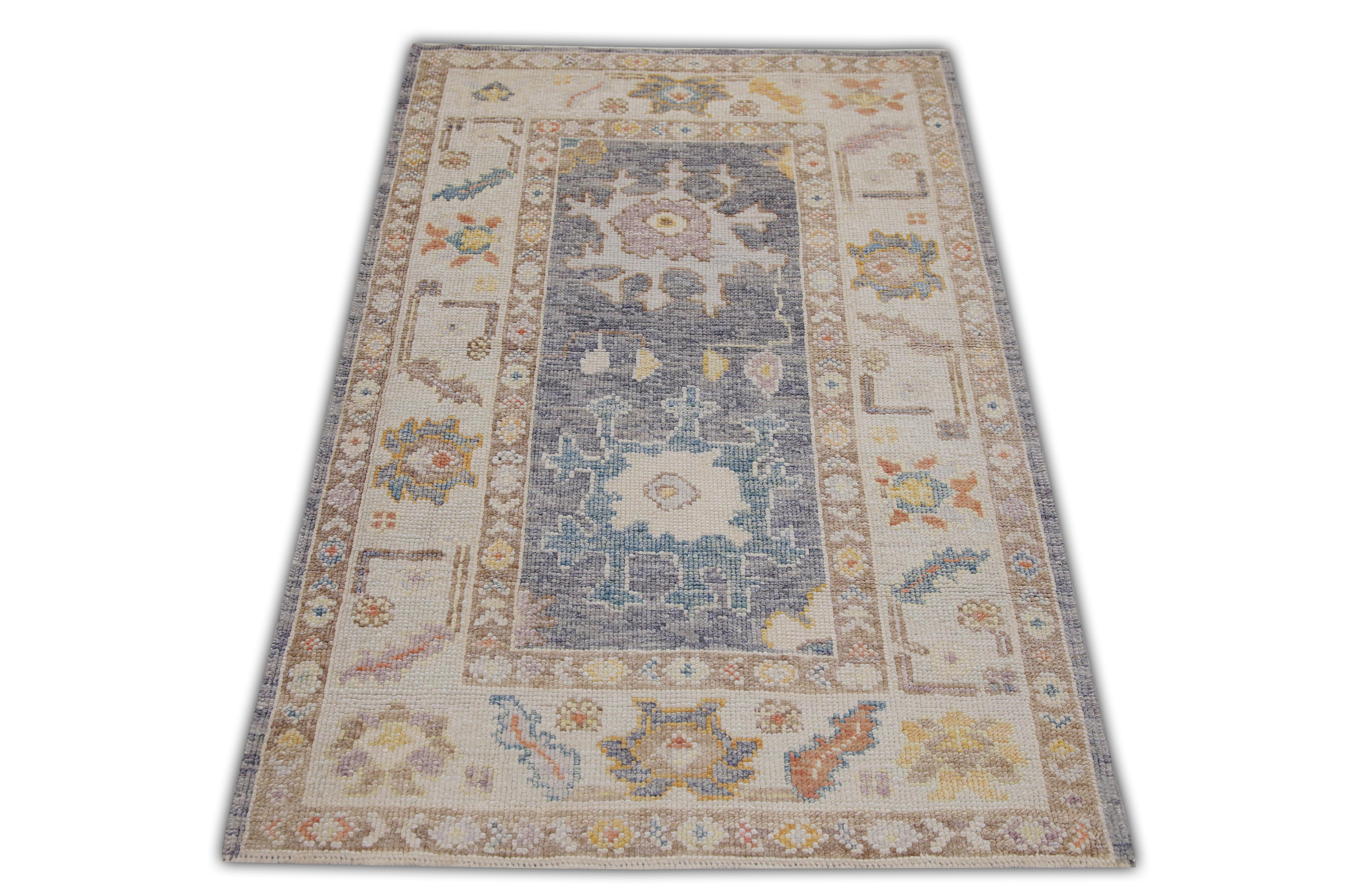 This Turkish oushak rug is a stunning piece of art that has been handwoven using traditional techniques by skilled artisans. The rug features intricate patterns and a soft color palette that is achieved through the use of natural vegetable