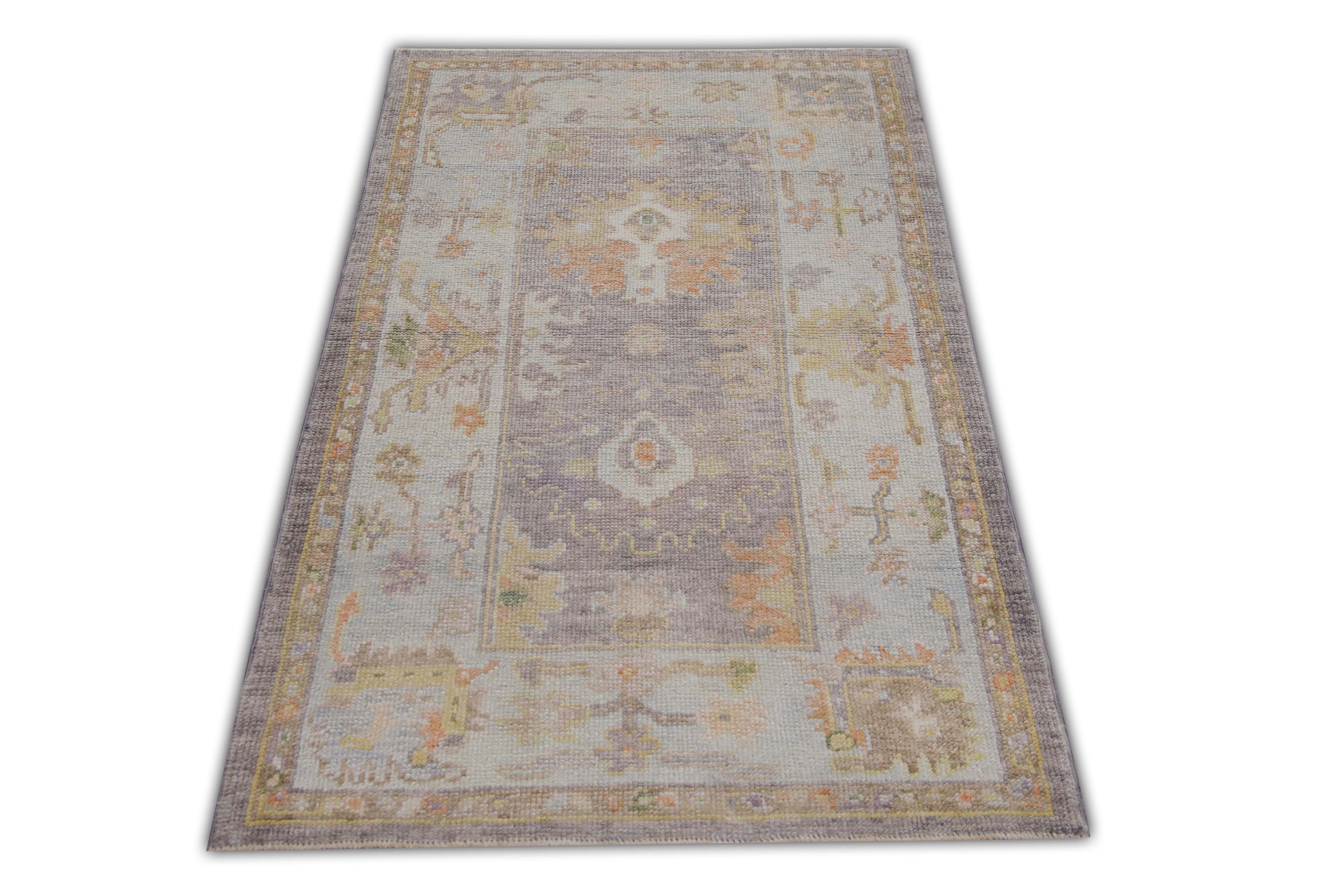 This Turkish oushak rug is a stunning piece of art that has been handwoven using traditional techniques by skilled artisans. The rug features intricate patterns and a soft color palette that is achieved through the use of natural vegetable