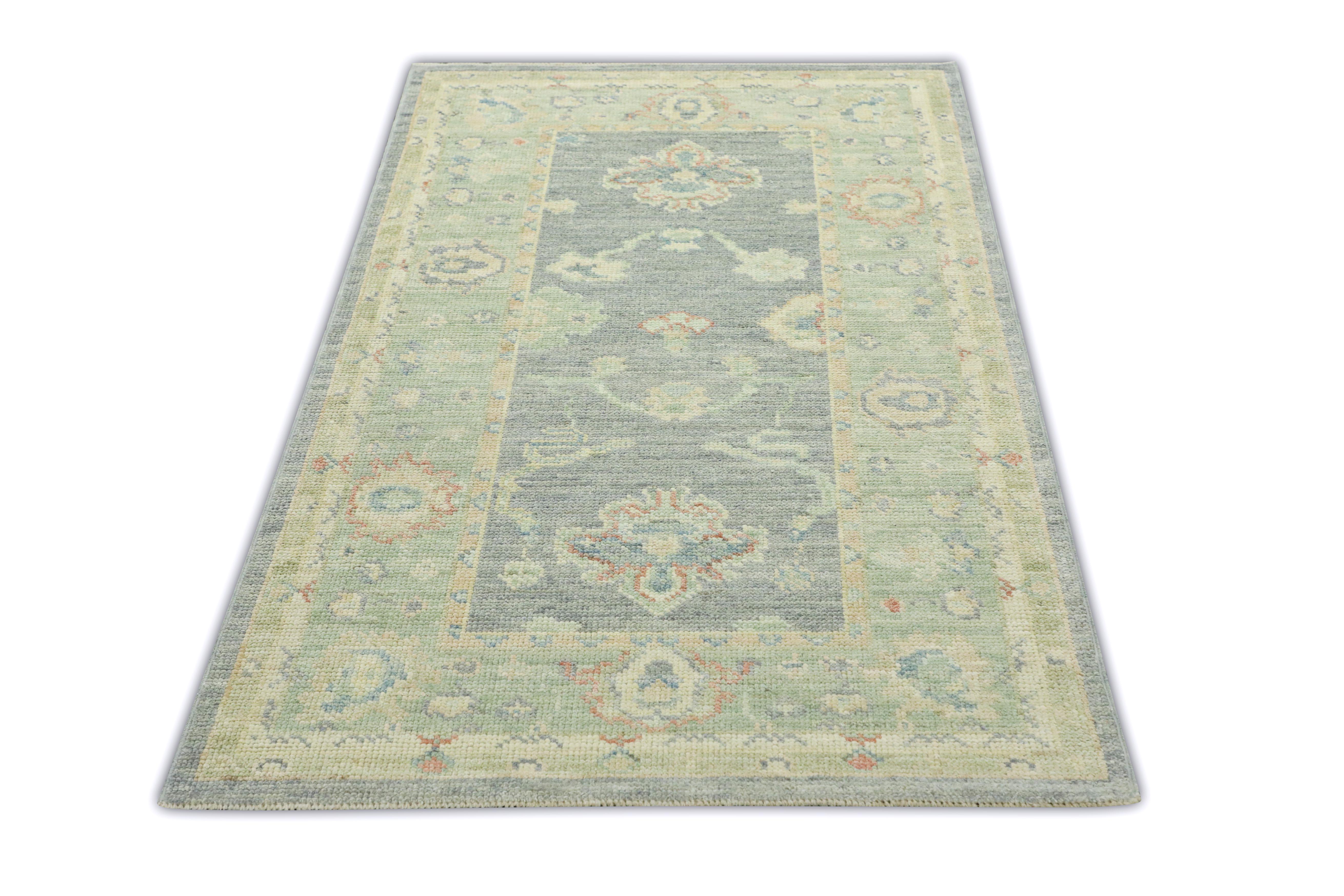 This Turkish oushak rug is a stunning piece of art that has been handwoven using traditional techniques by skilled artisans. The rug features intricate patterns and a soft color palette that is achieved through the use of natural vegetable dyes.