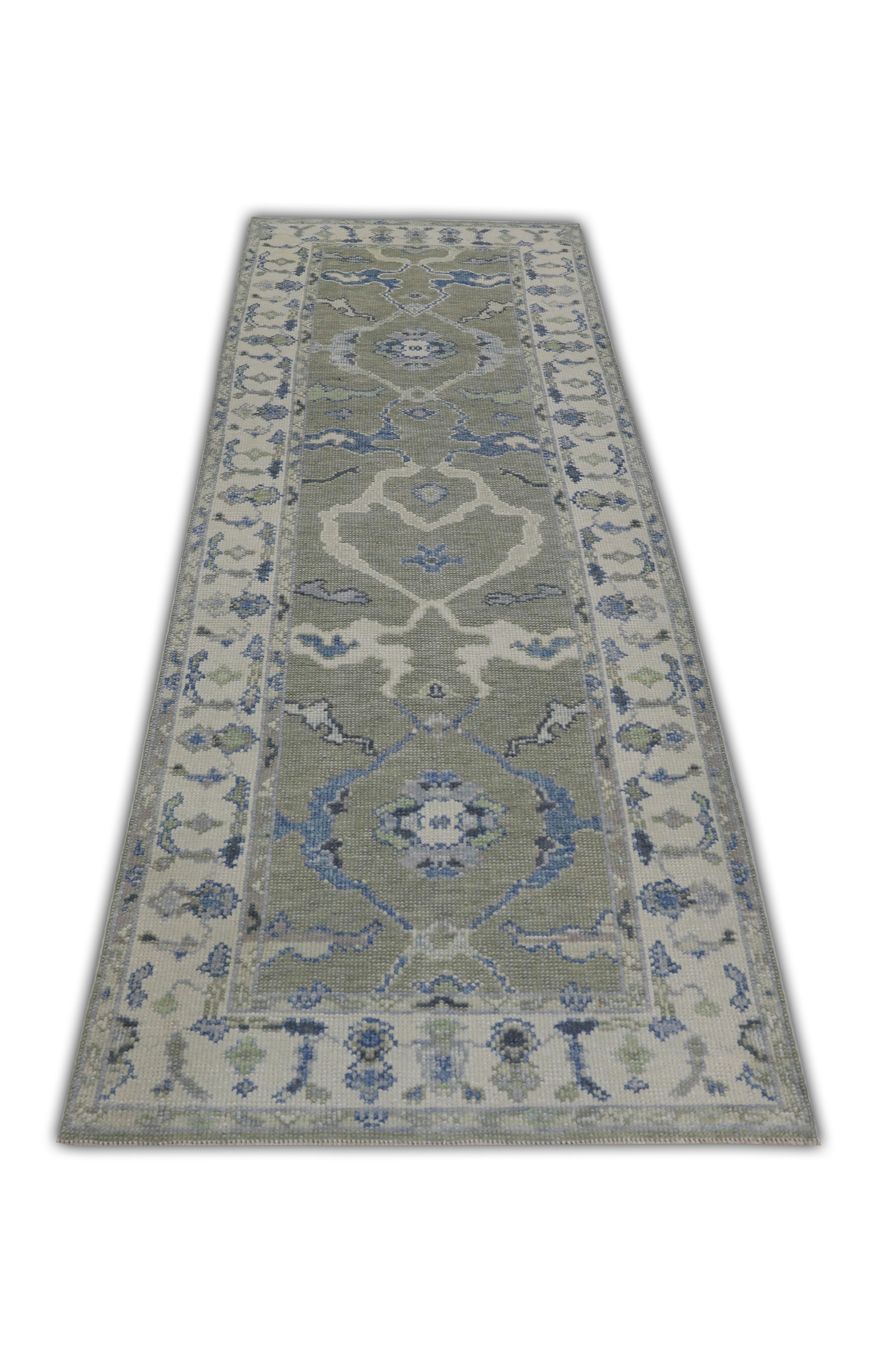 This Turkish oushak rug is a stunning piece of art that has been handwoven using traditional techniques by skilled artisans. The rug features intricate patterns and a soft color palette that is achieved through the use of natural vegetable dyes.