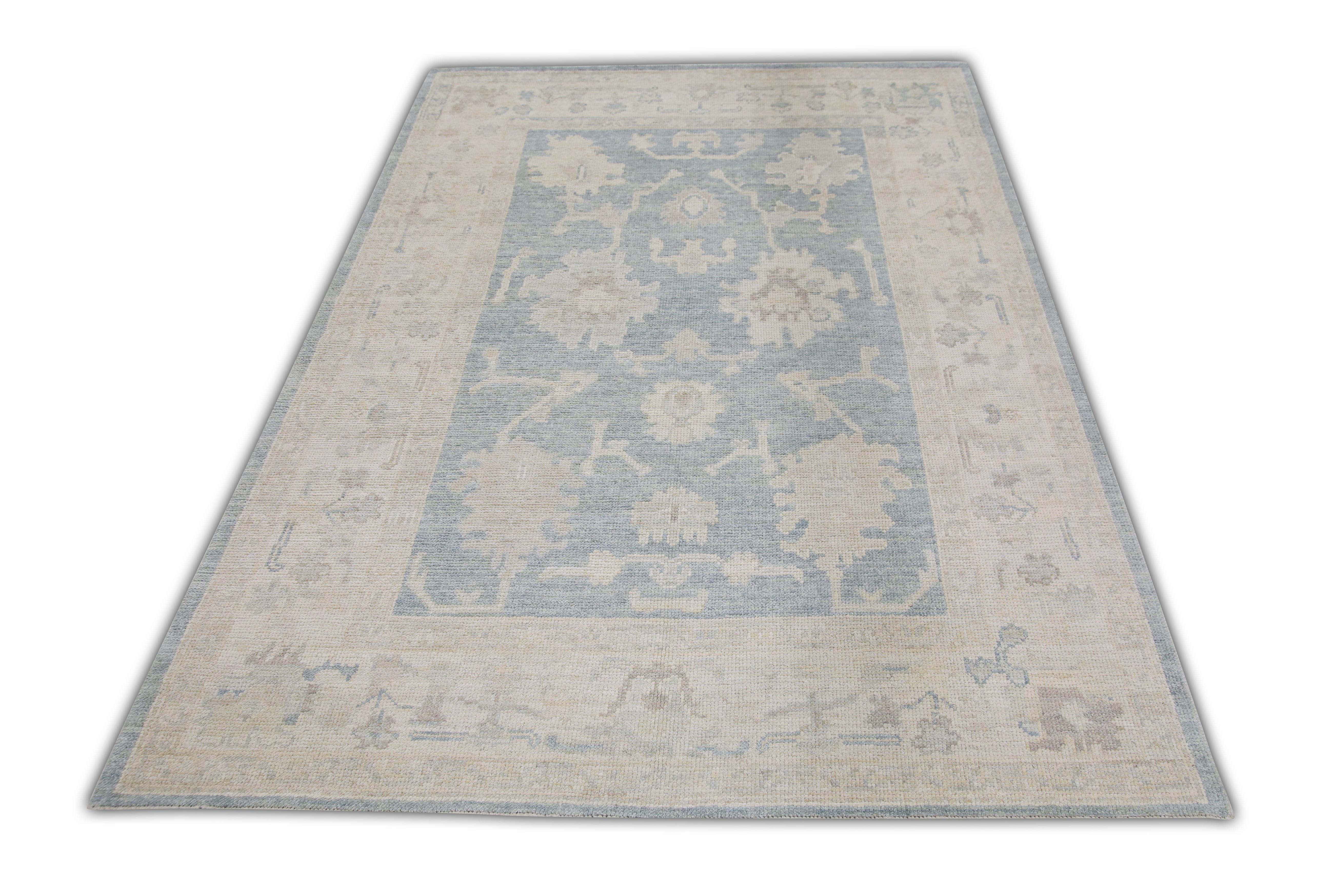 This Turkish oushak rug is a stunning piece of art that has been handwoven using traditional techniques by skilled artisans. The rug features intricate patterns and a soft color palette that is achieved through the use of natural vegetable