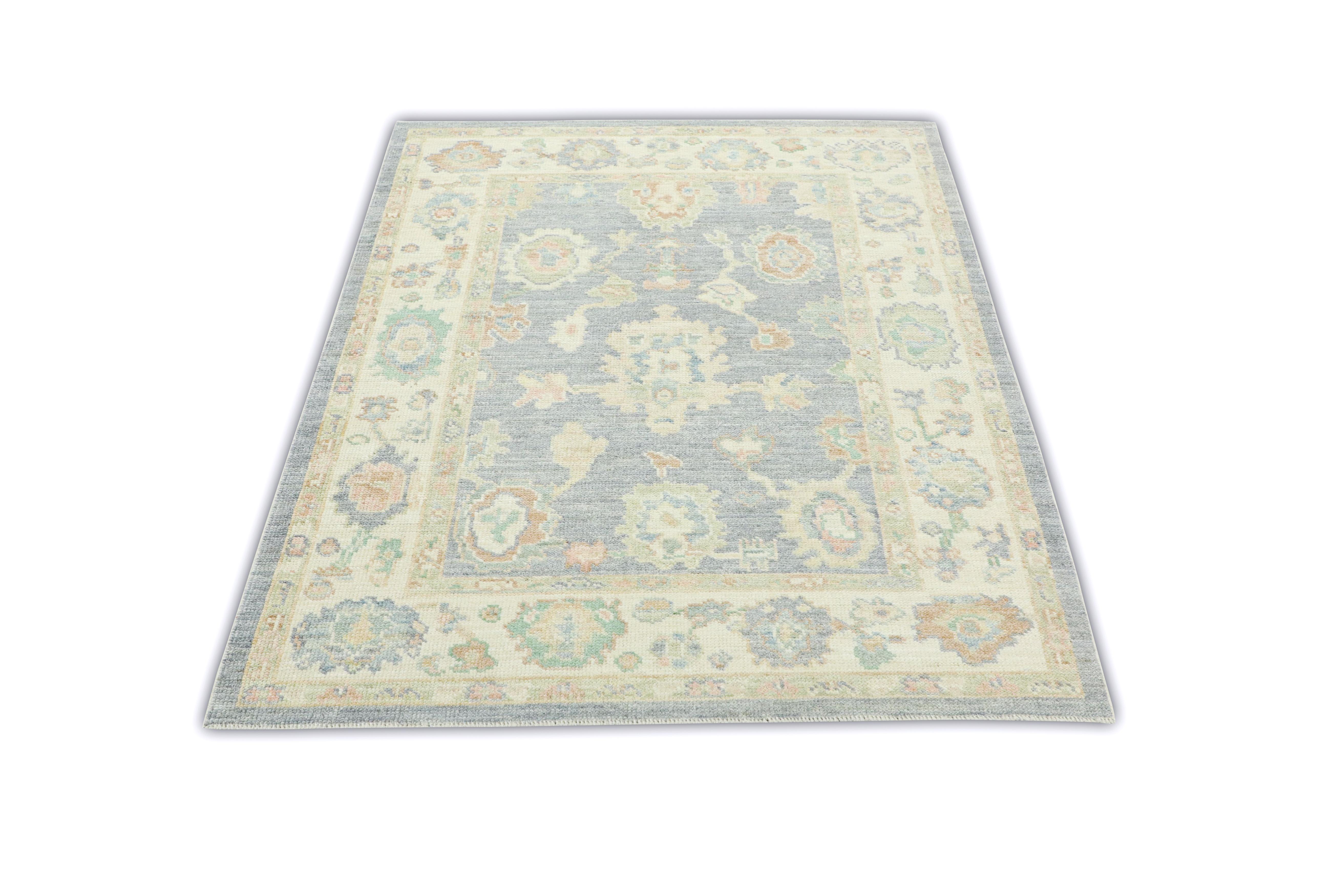 This Turkish oushak rug is a stunning piece of art that has been handwoven using traditional techniques by skilled artisans. The rug features intricate patterns and a soft color palette that is achieved through the use of natural vegetable dyes.