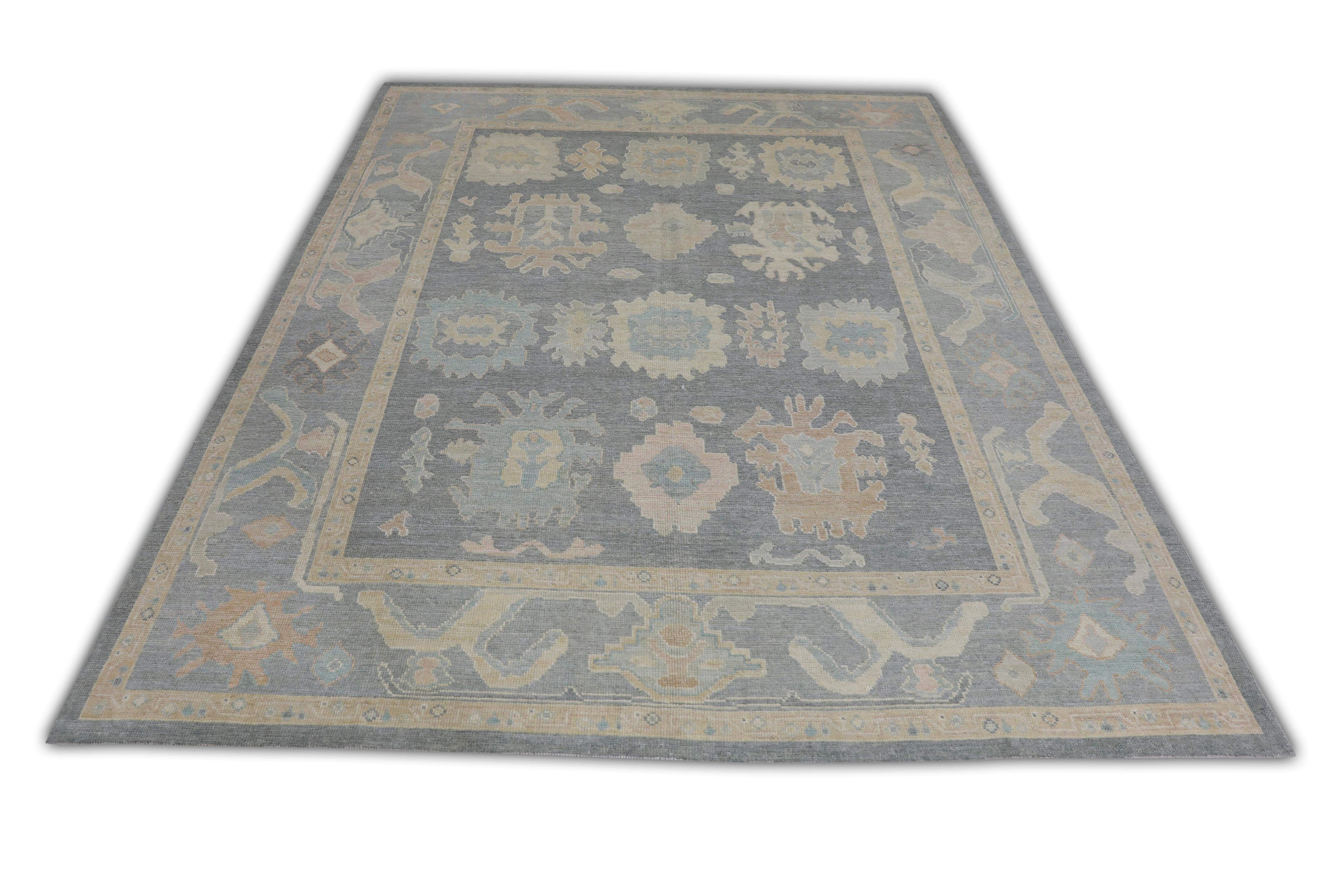 This Turkish Oushak rug is a stunning piece of art that has been handwoven using traditional techniques by skilled artisans. The rug features intricate patterns and a soft color palette that is achieved through the use of natural vegetable dyes.