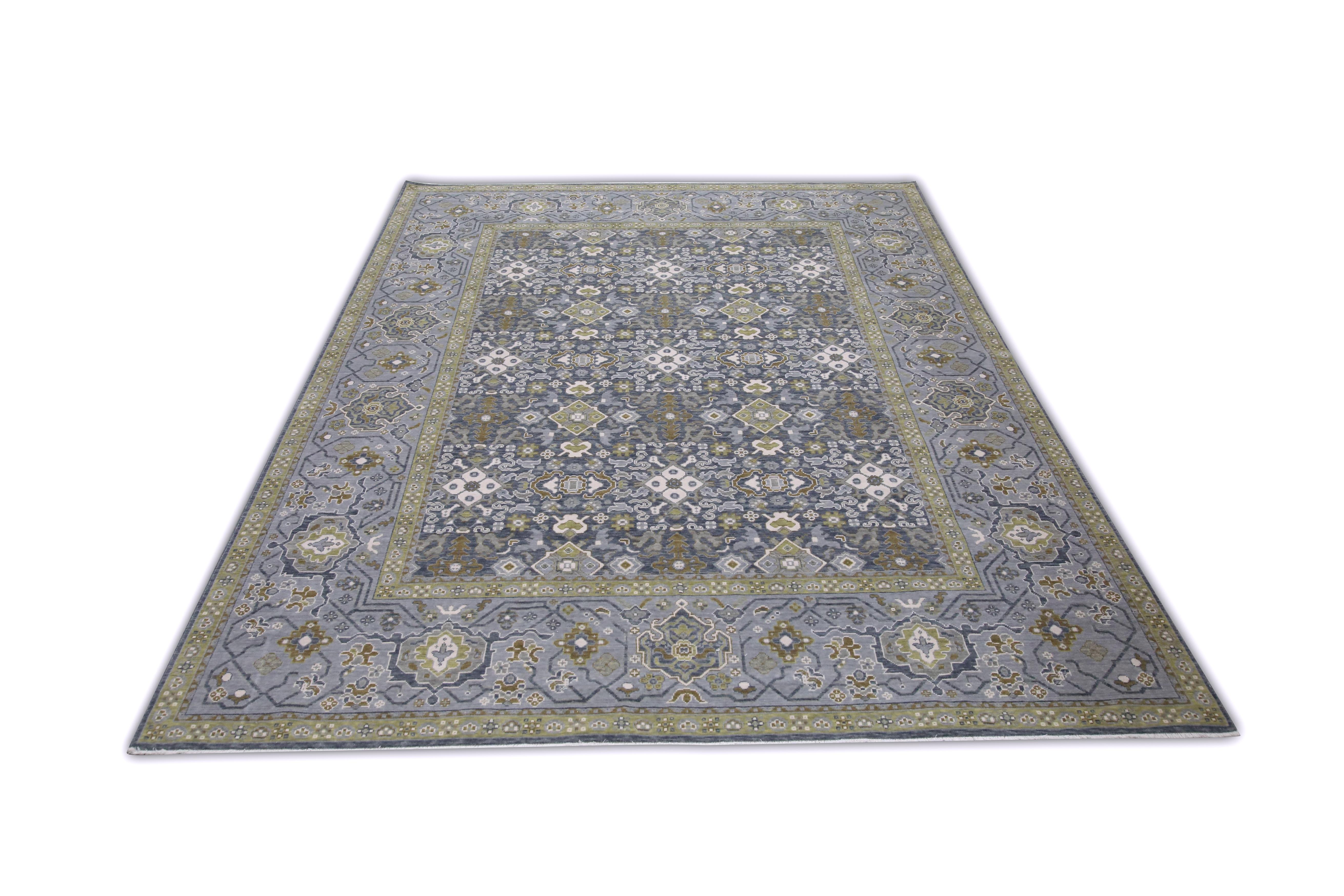 This Turkish oushak rug is a stunning piece of art that has been handwoven using traditional techniques by skilled artisans. The rug features intricate patterns and a soft color palette that is achieved through the use of natural vegetable