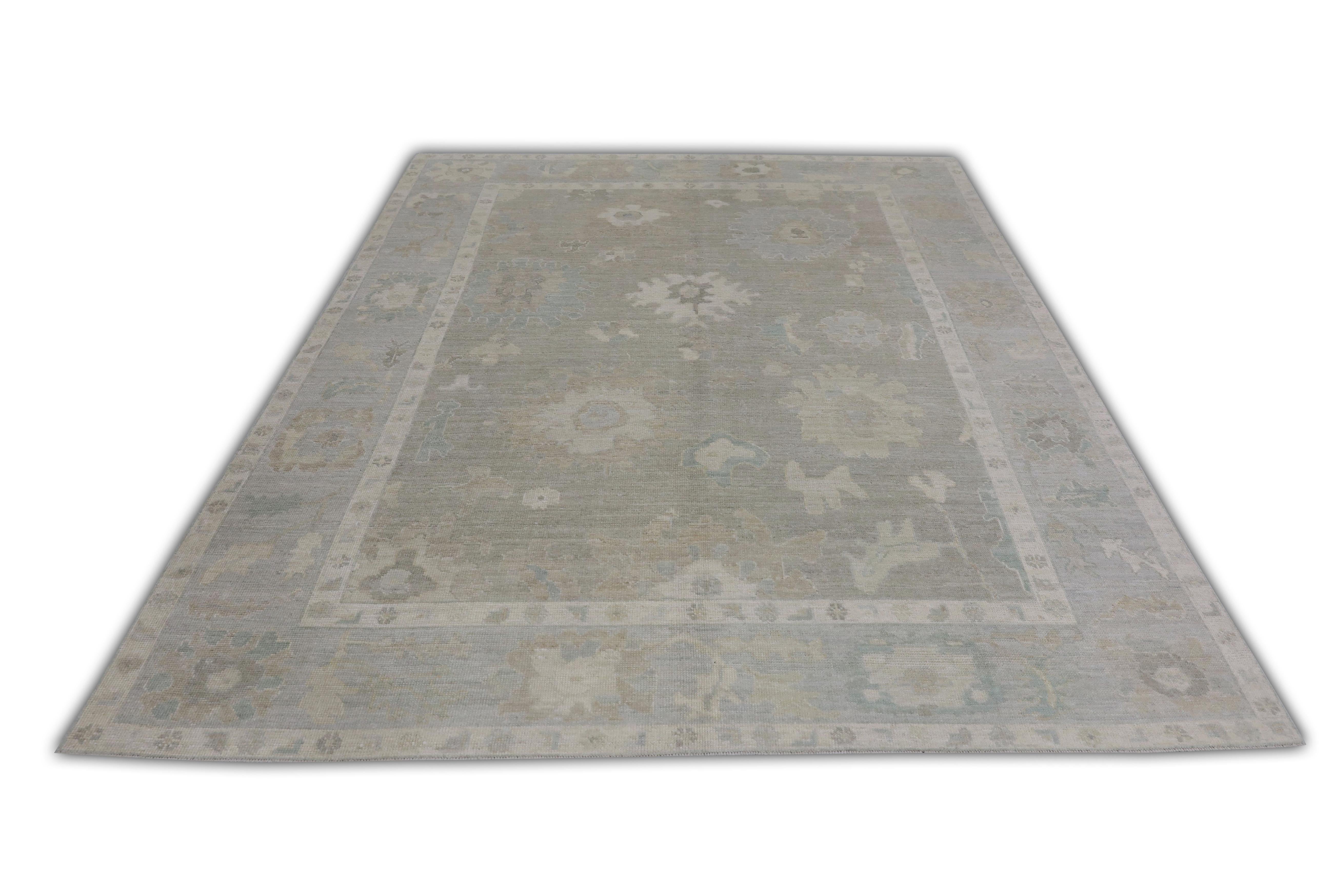 This Turkish oushak rug is a stunning piece of art that has been handwoven using traditional techniques by skilled artisans. The rug features intricate patterns and a soft color palette that is achieved through the use of natural vegetable dyes.