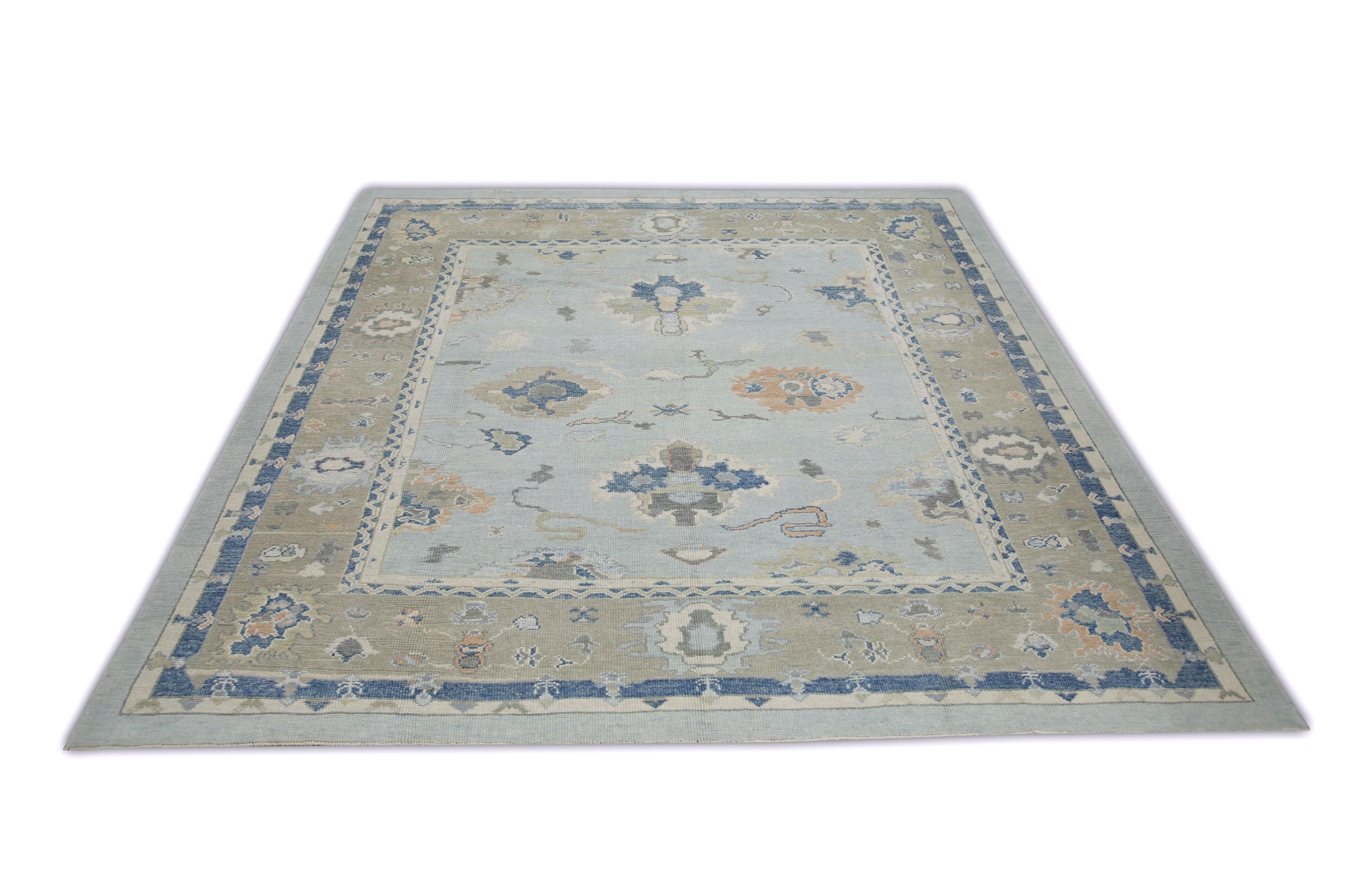 This Turkish oushak rug is a stunning piece of art that has been handwoven using traditional techniques by skilled artisans. The rug features intricate patterns and a soft color palette that is achieved through the use of natural vegetable