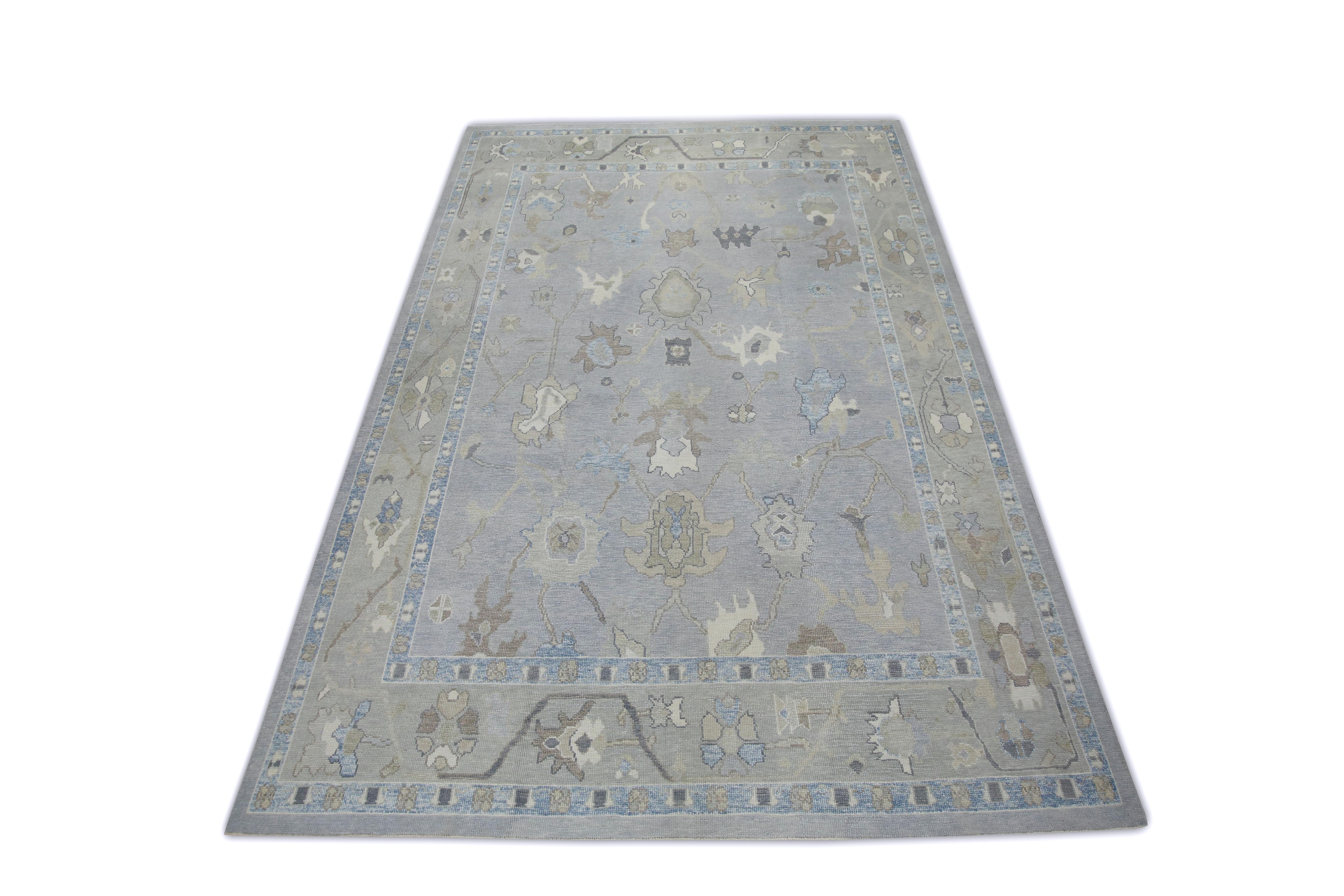 This Turkish oushak rug is a stunning piece of art that has been handwoven using traditional techniques by skilled artisans. The rug features intricate patterns and a soft color palette that is achieved through the use of natural vegetable