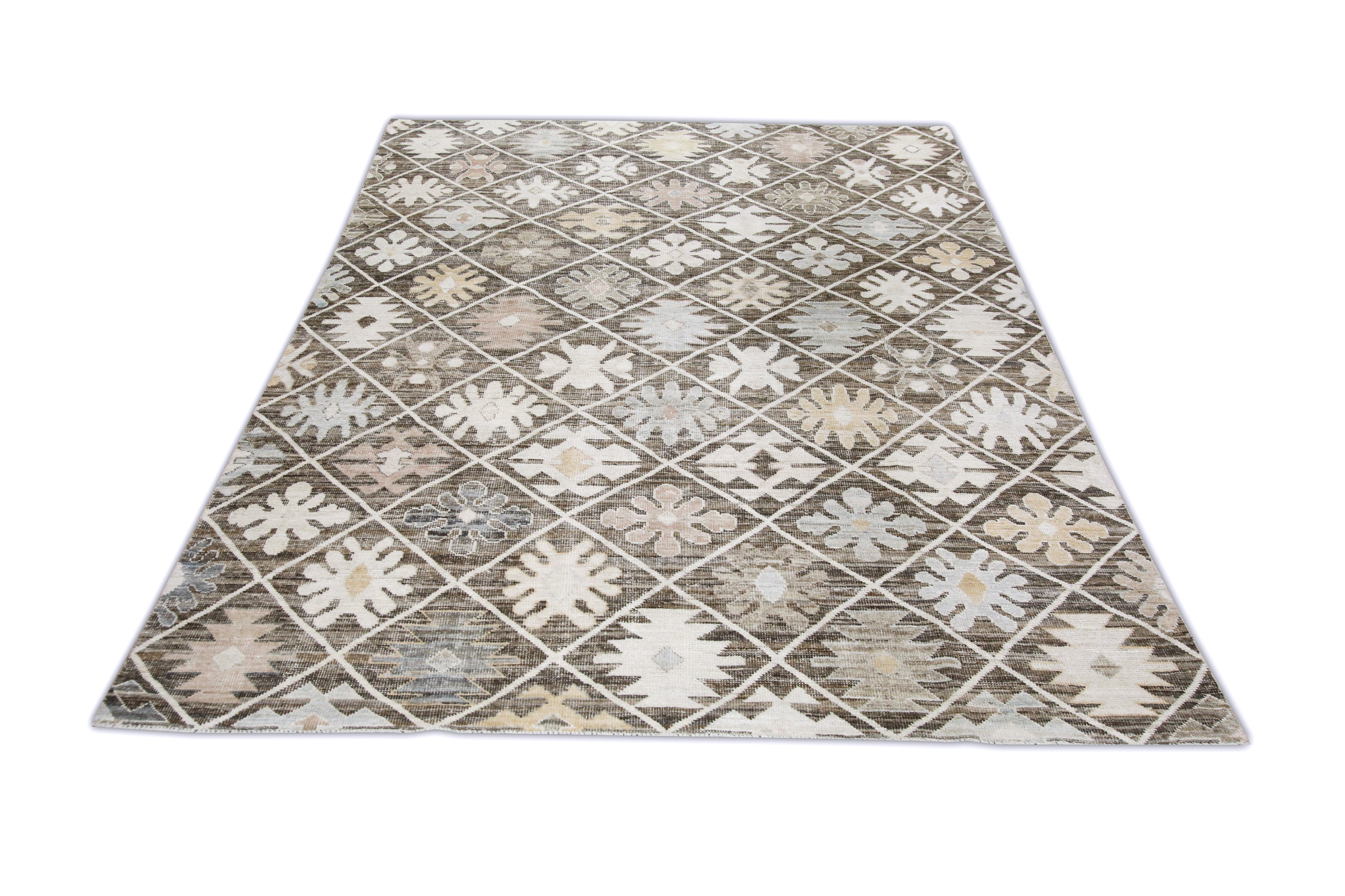 This Turkish oushak rug is a stunning piece of art that has been handwoven using traditional techniques by skilled artisans. The rug features intricate patterns and a soft color palette that is achieved through the use of natural vegetable