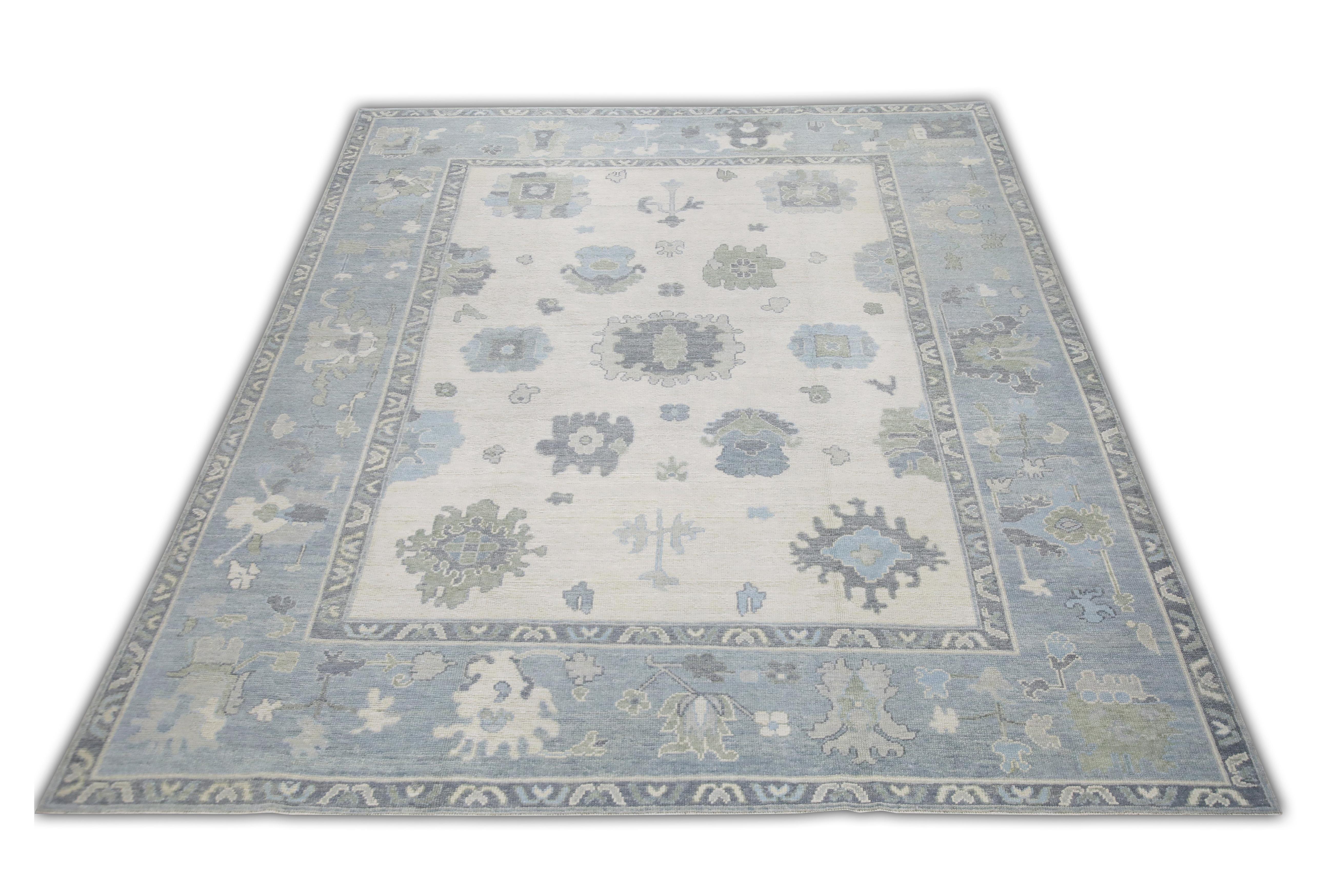 This Turkish oushak rug is a stunning piece of art that has been handwoven using traditional techniques by skilled artisans. The rug features intricate patterns and a soft color palette that is achieved through the use of natural vegetable