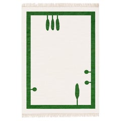 Tapis tissé à la main avec un motif vert et des franges sur les côtés