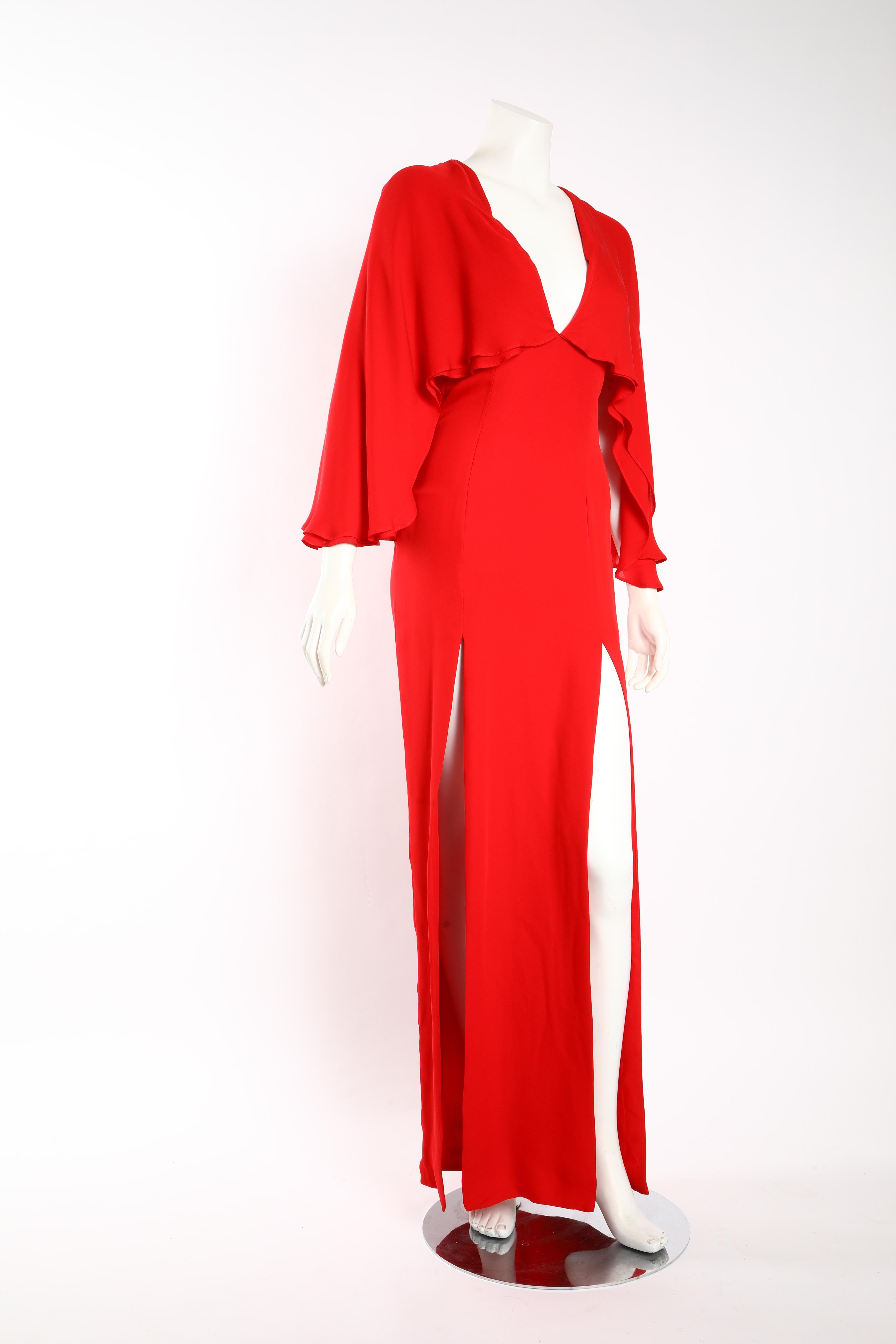 Haney silk chiffon gown in blood red with double layered cape back and two deep slits. Features deep-v neckline. Size US 6. 